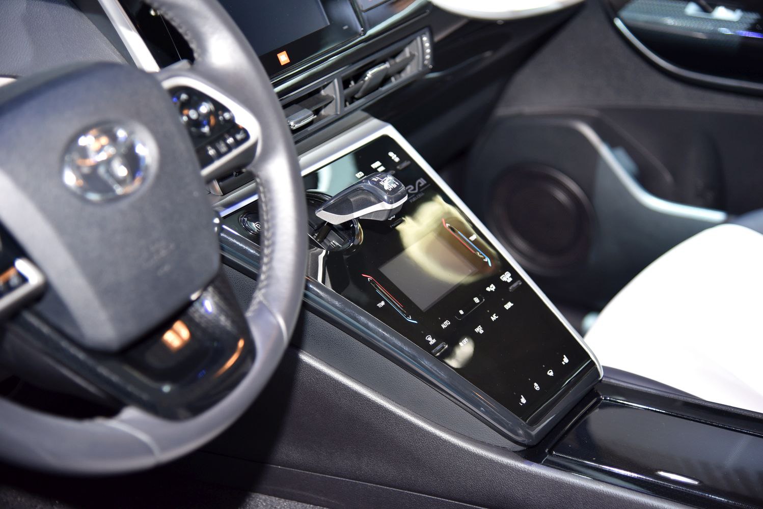 Gear shift lever with digital touch control panel in modern car interior