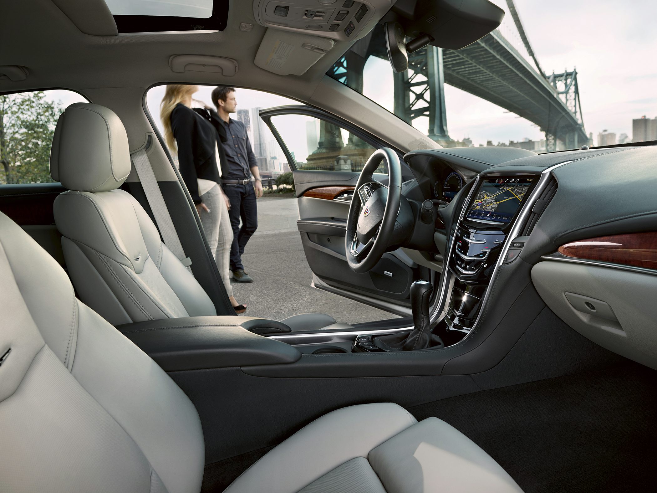 Luxurious leather seats and modern infotainment system with wood trim interior