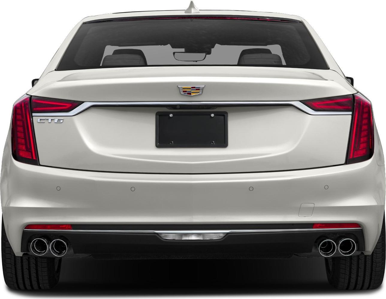 Luxury sedan rear with quad exhaust and sleek tail lights