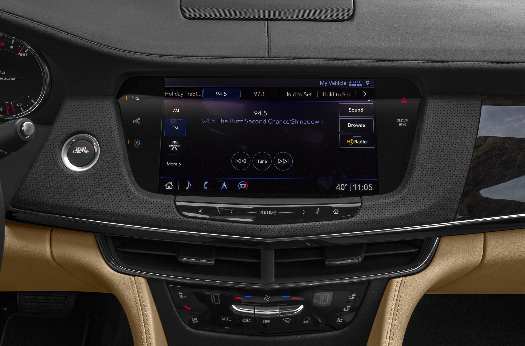 Modern touchscreen infotainment and engine start button in luxury vehicle interior