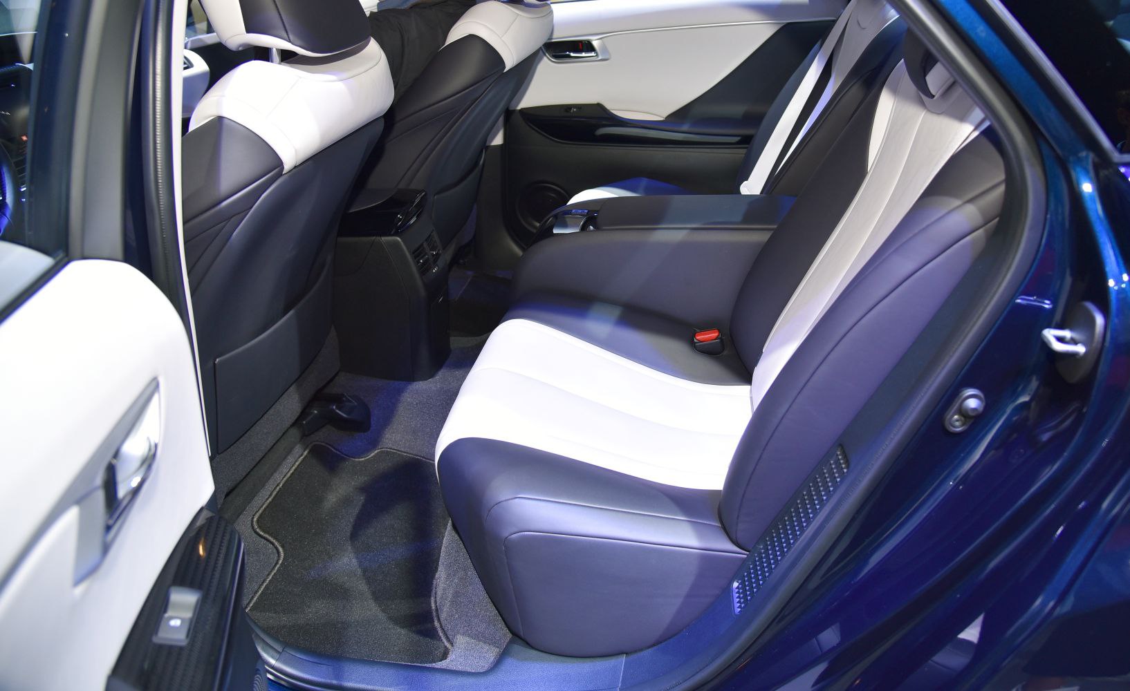 Luxury rear interior seats with black and white leather upholstery