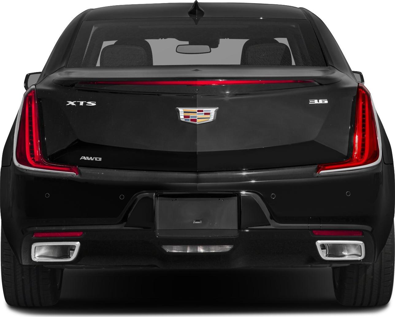 Rear view with vertical LED taillights, dual exhaust outlets, and luxury emblem