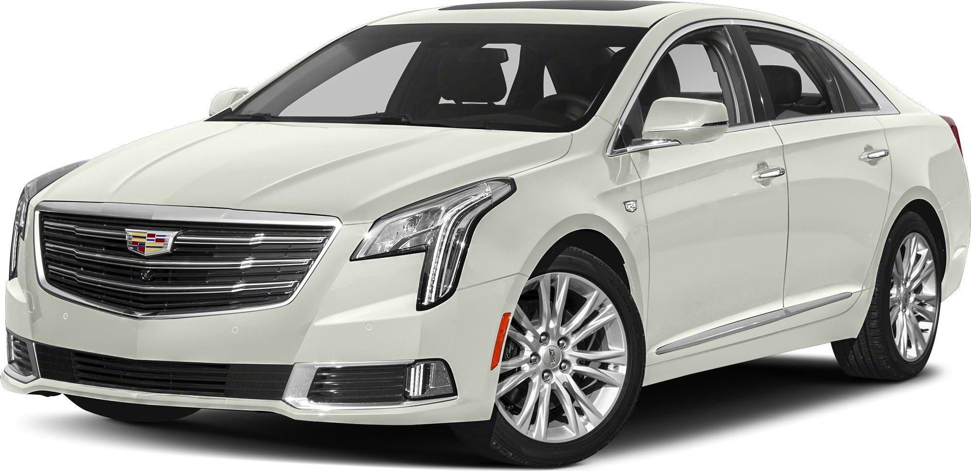 Front view of a luxury sedan with vertical LED headlights and chrome grille