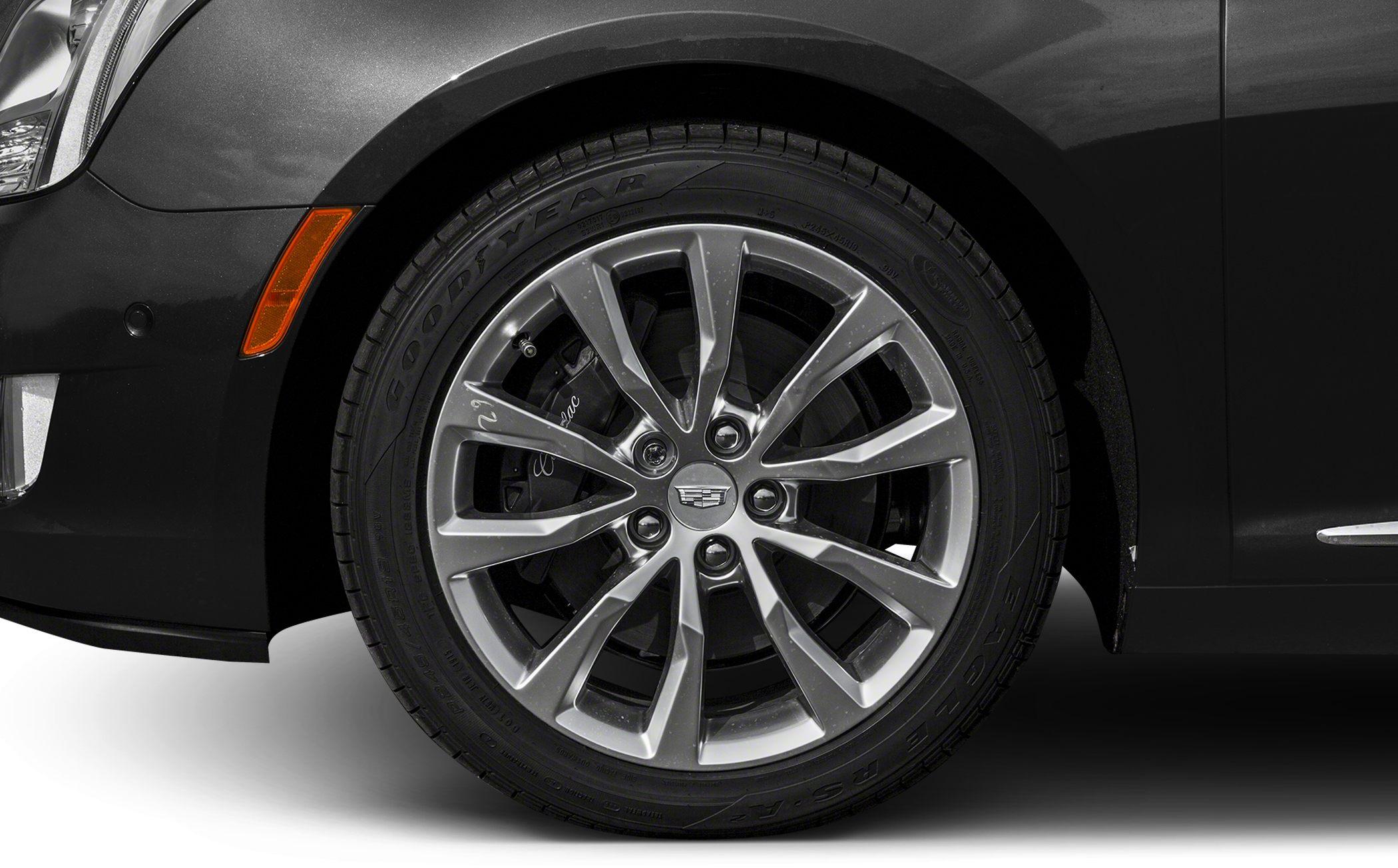Multi-spoke alloy rim and Goodyear Eagle tire on front wheel