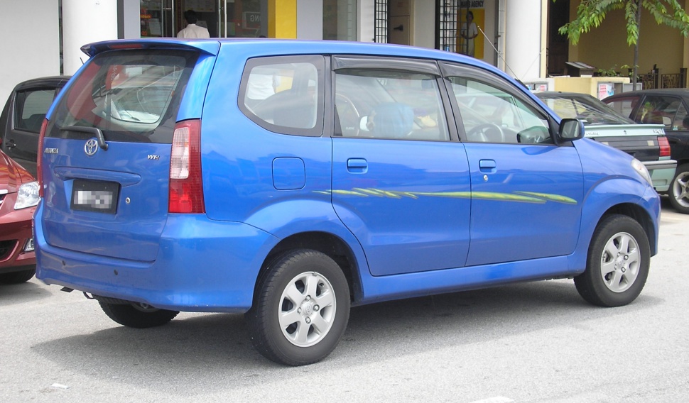 Side rear view of a compact blue MPV with distinct rear lights and window shapes.