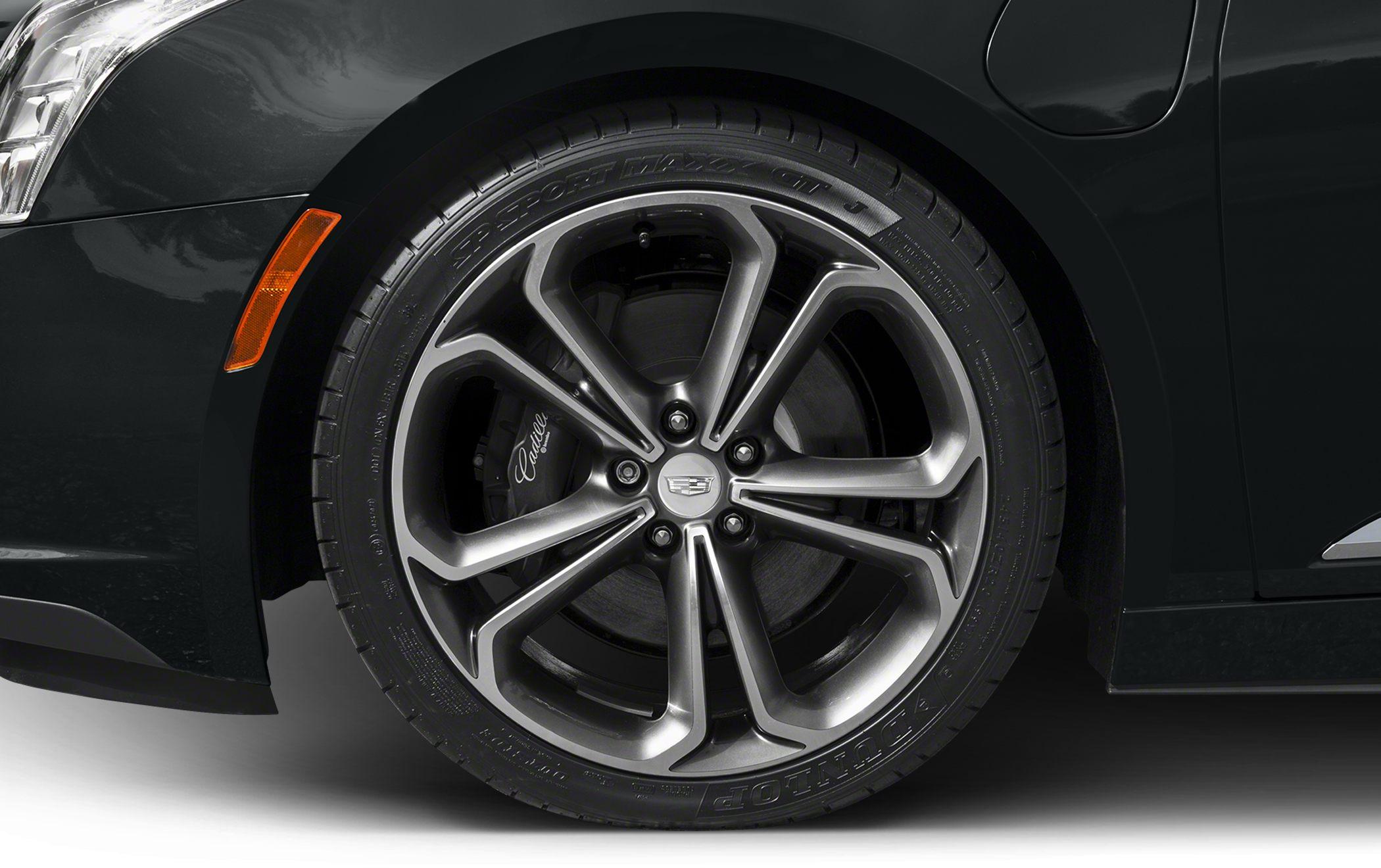 Detailed alloy wheel and brake caliper on modern vehicle