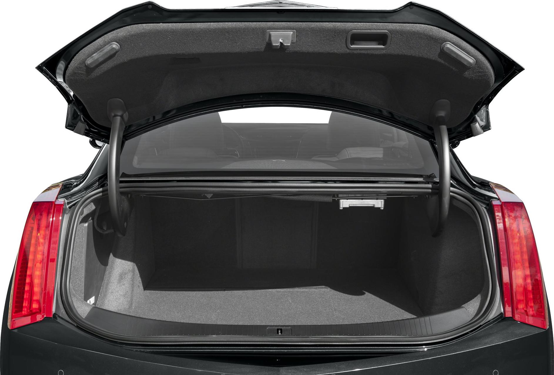 Spacious rear trunk cargo space with open trunk lid and rear lights