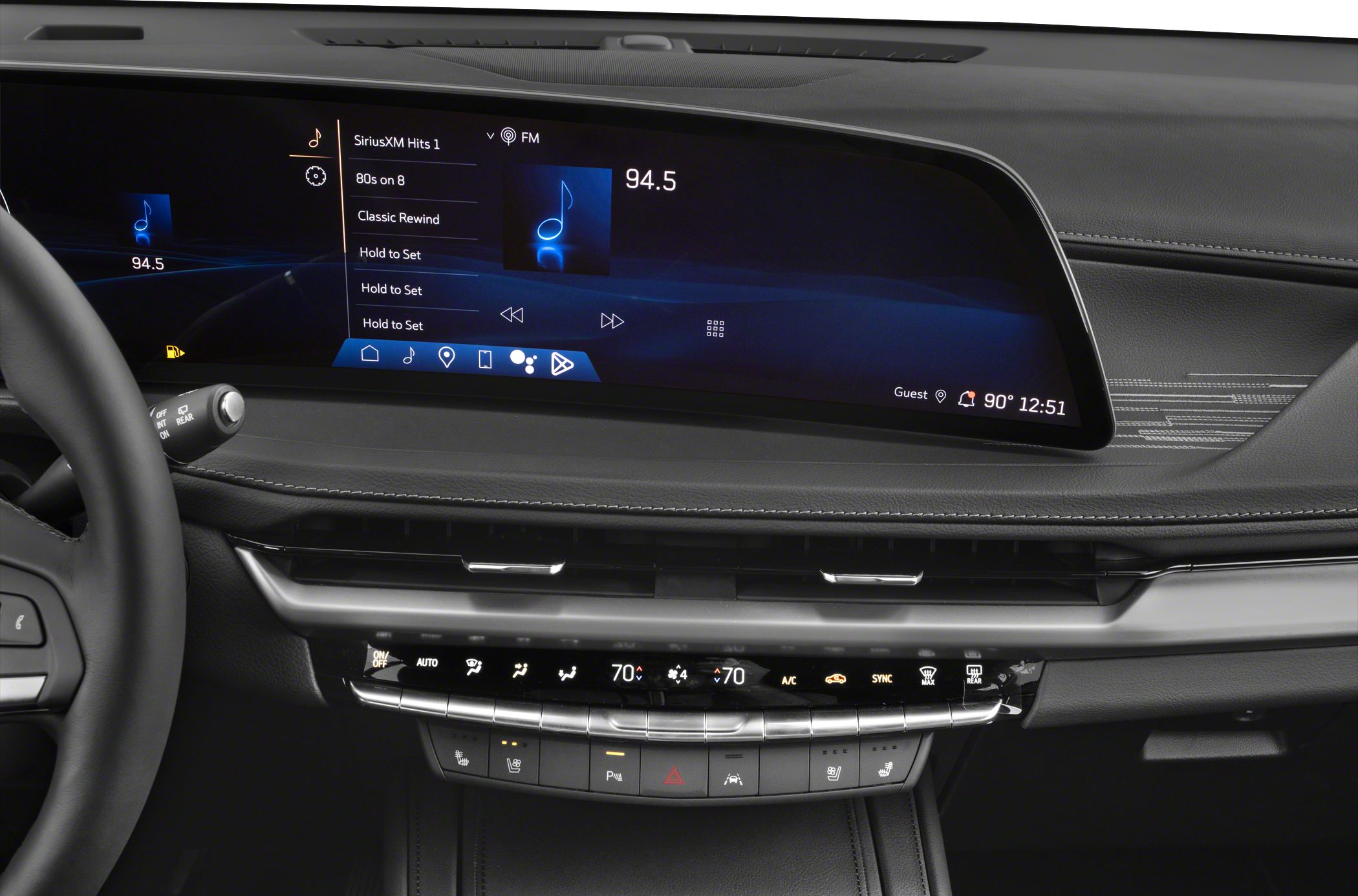 Dual wide digital displays and climate control panel in luxury SUV interior