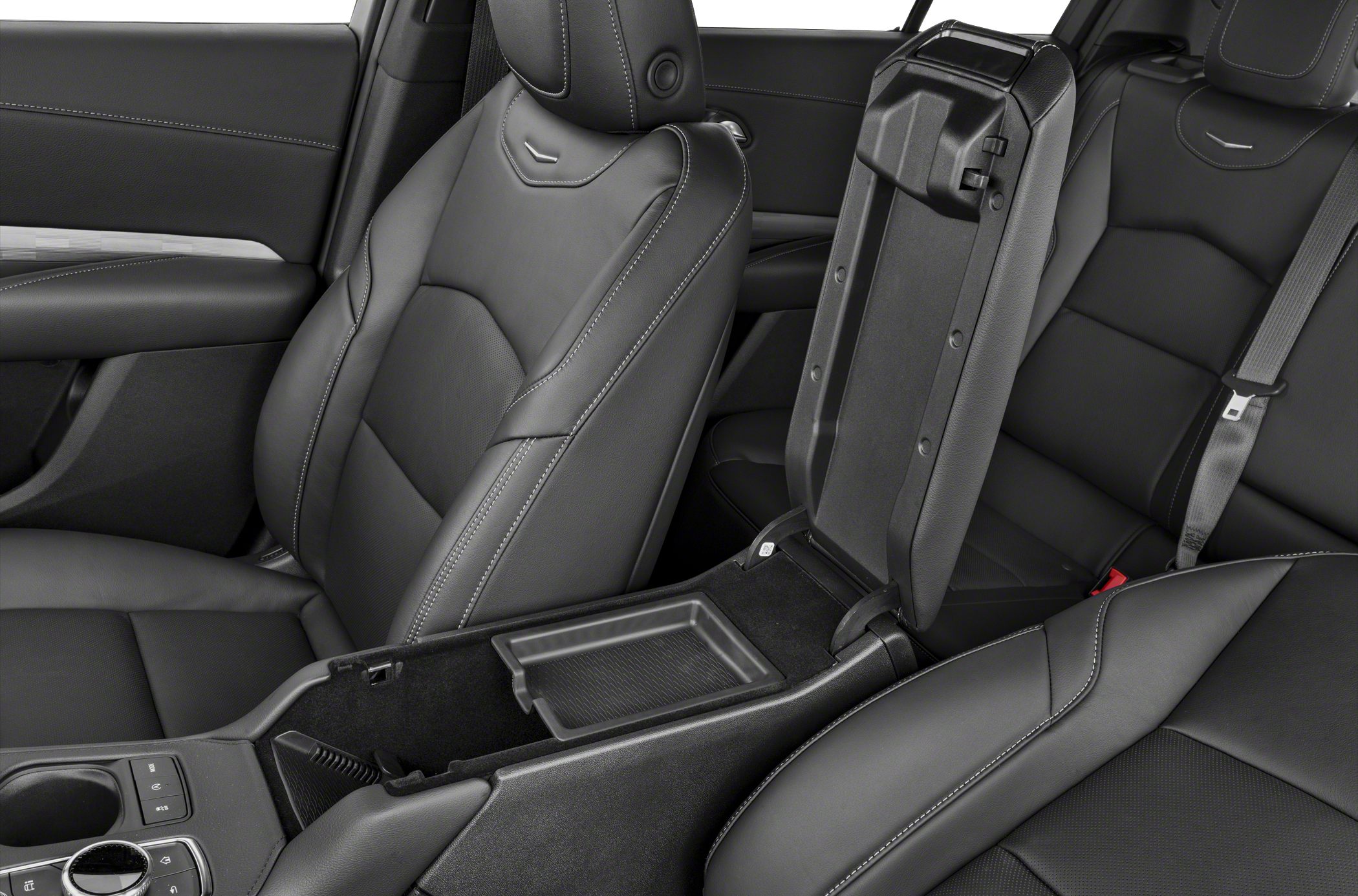 Black leather seats with white stitching and open center console storage with tray