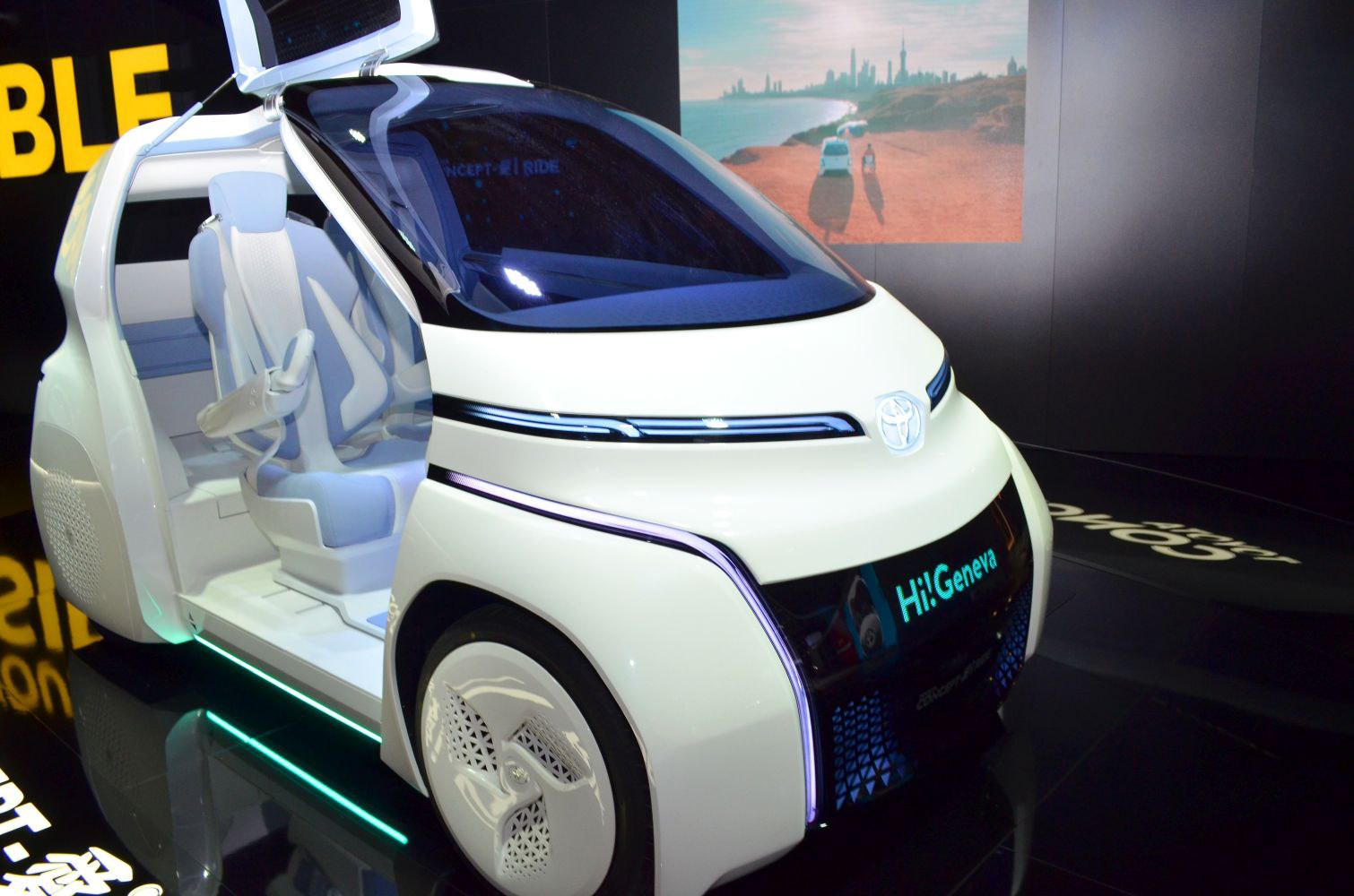 Futuristic electric vehicle with gullwing door and digital front display