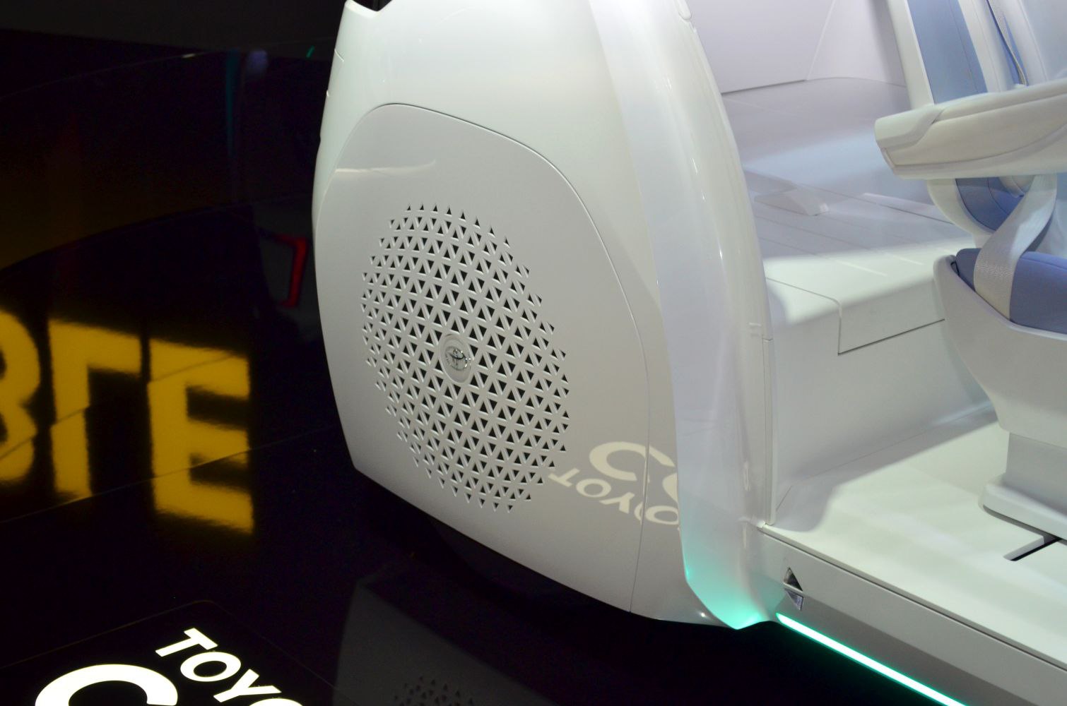 Futuristic interior with speaker grille and ambient lighting