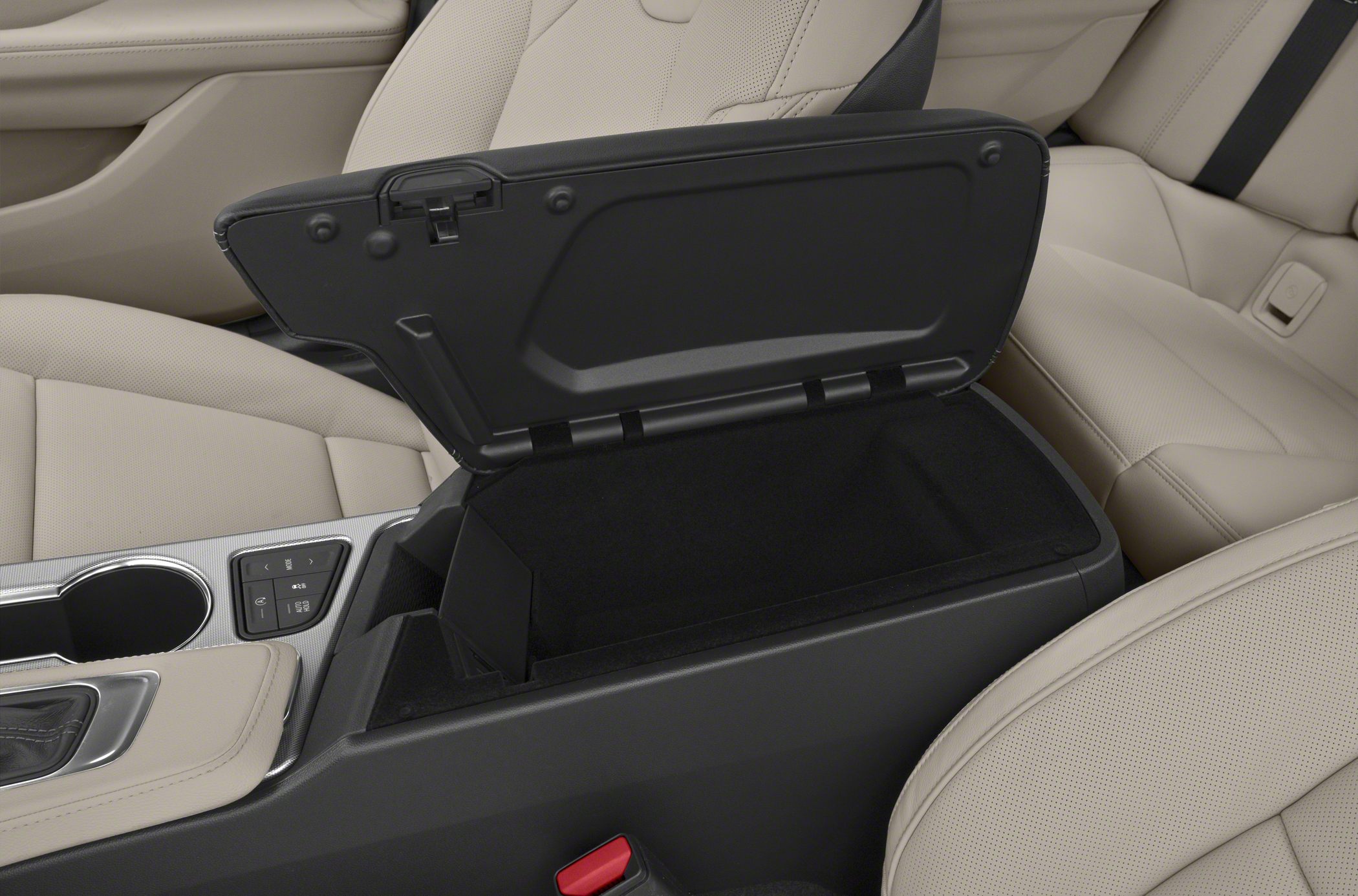 Interior center console with open storage compartment and beige perforated seats