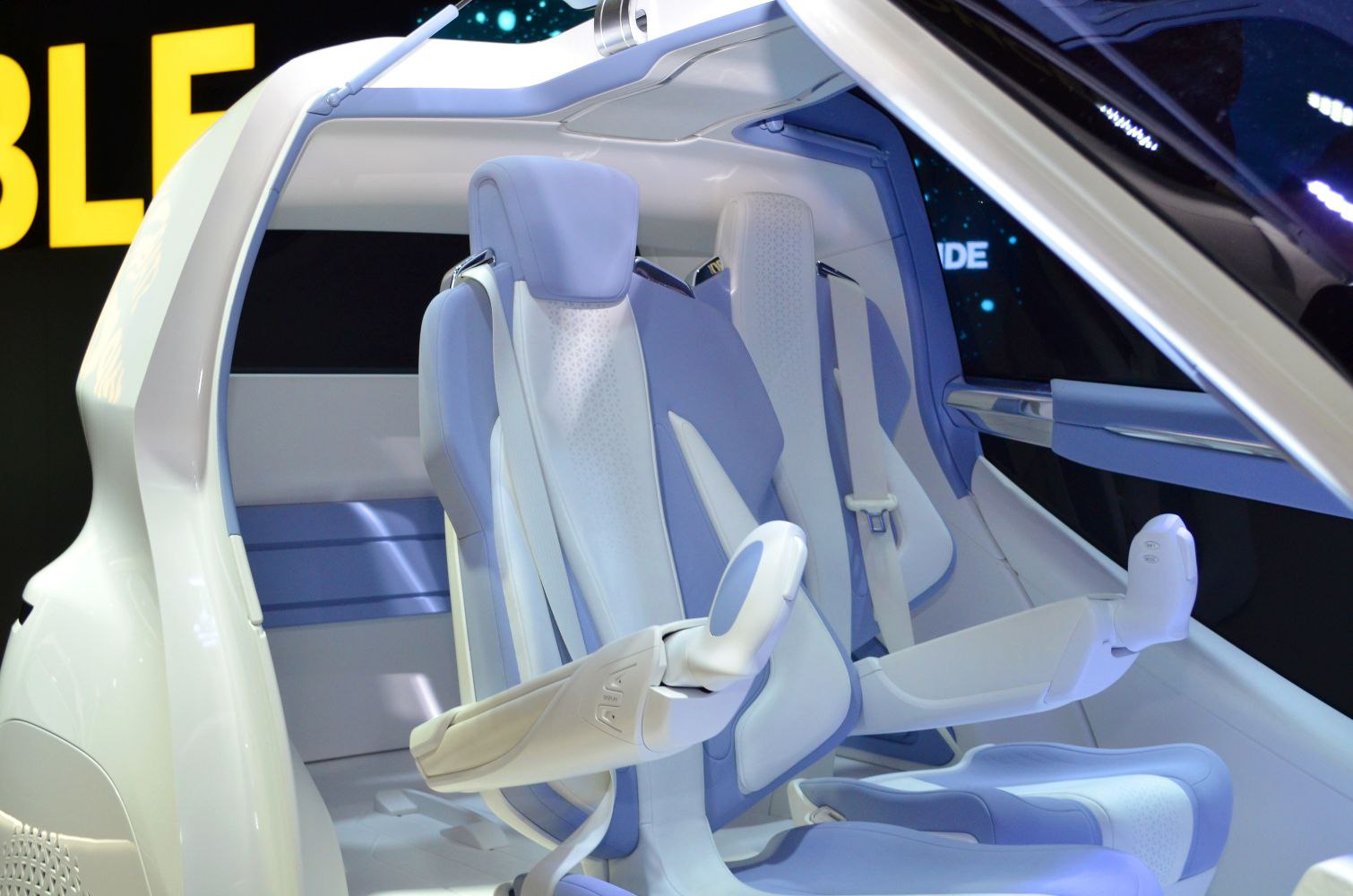 Futuristic car seats with integrated armrest controls and sleek design