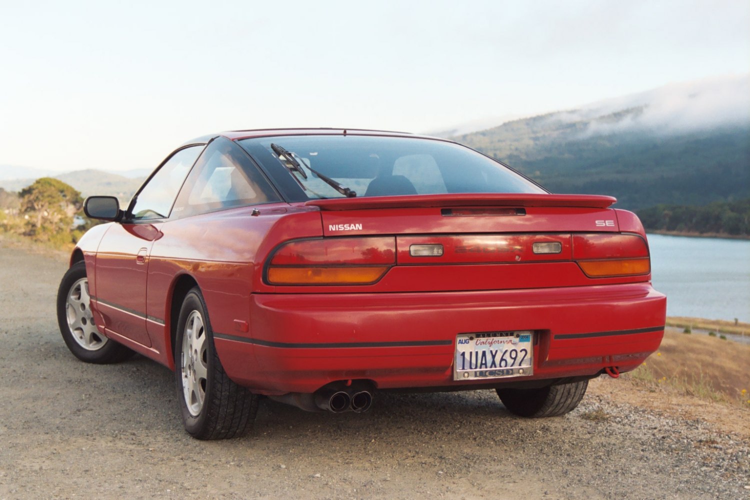 Red 1991 fastback coupe rear with taillights and spoiler