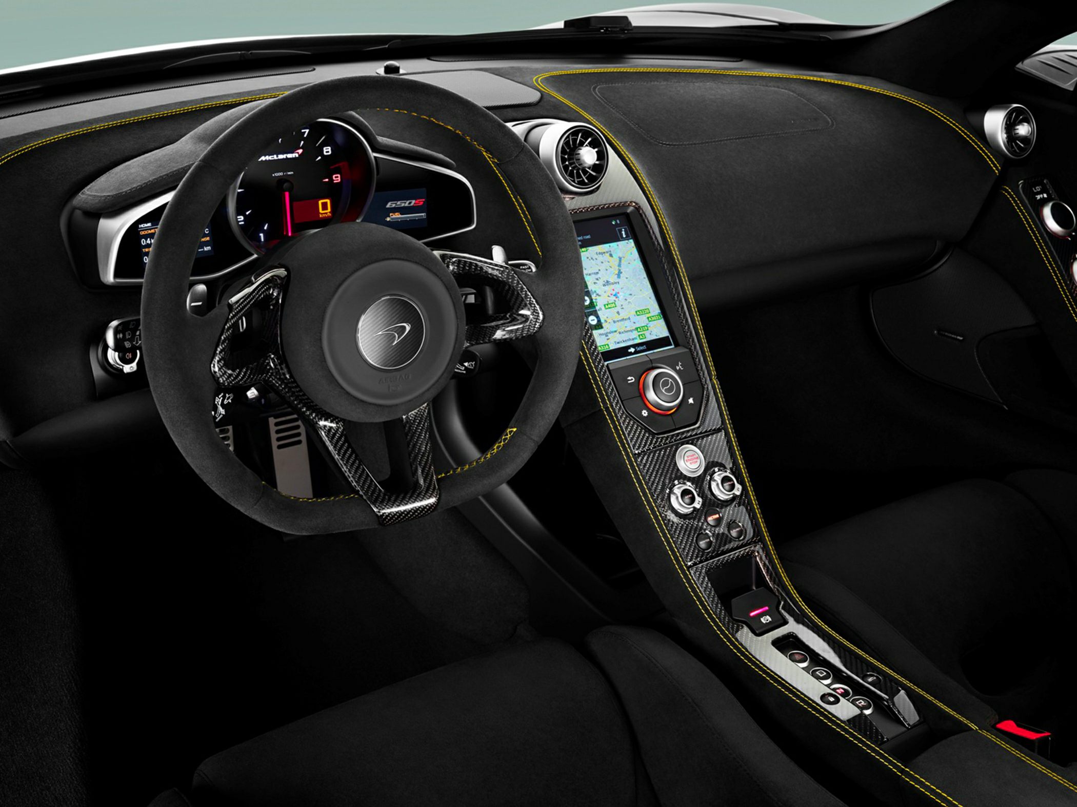 Carbon fiber steering wheel with digital instrument cluster and tech-focused dashboard