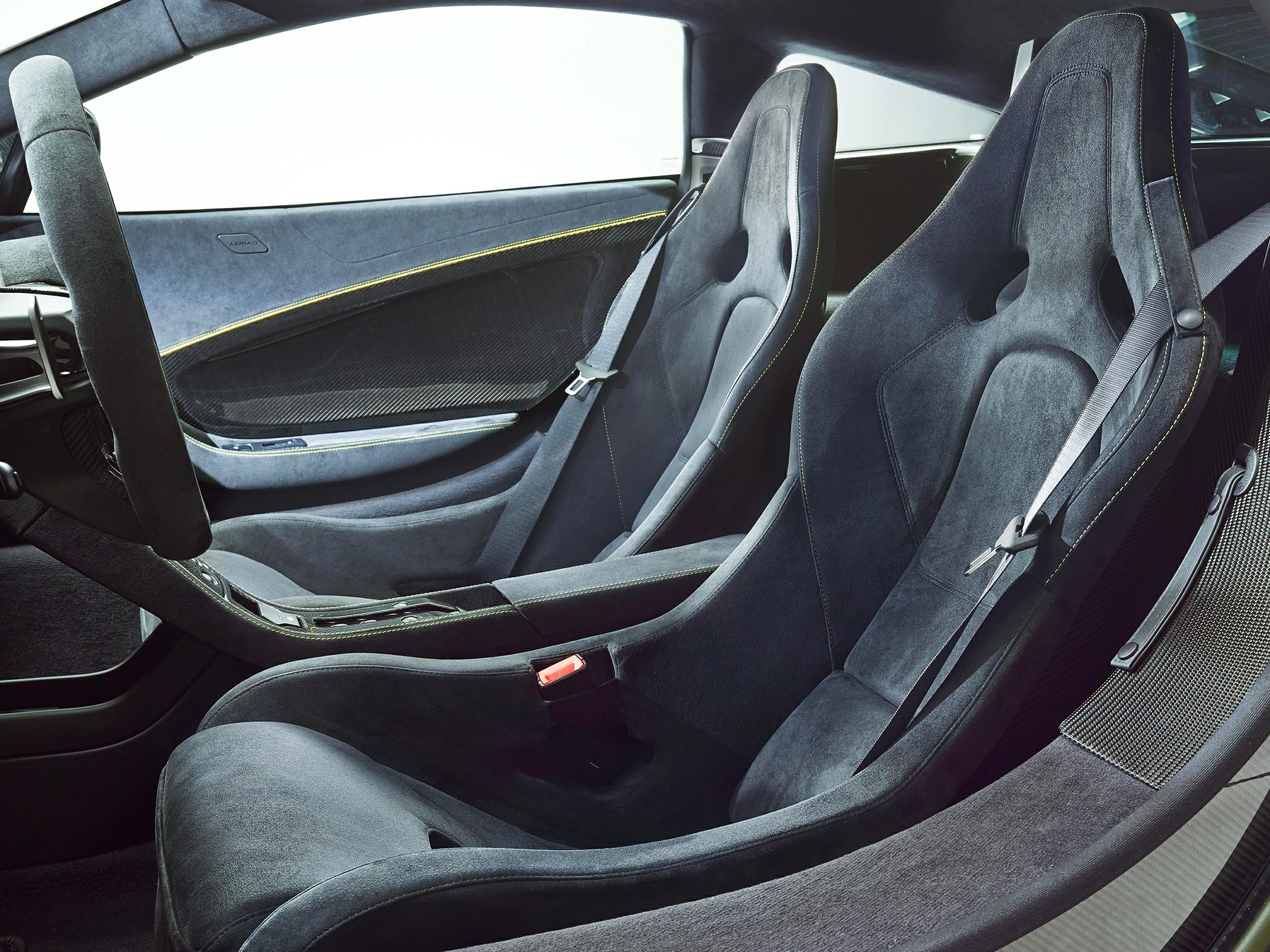 Sporty racing bucket seats with carbon fiber and premium upholstery