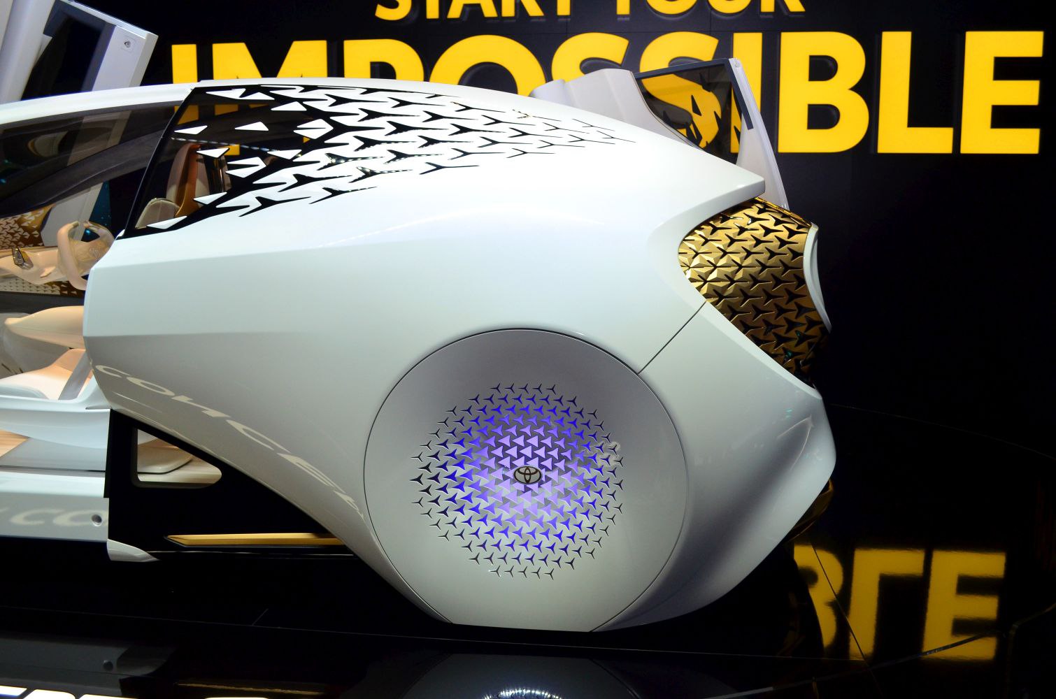 Futuristic geometric patterned wheel and smooth concept car side profile