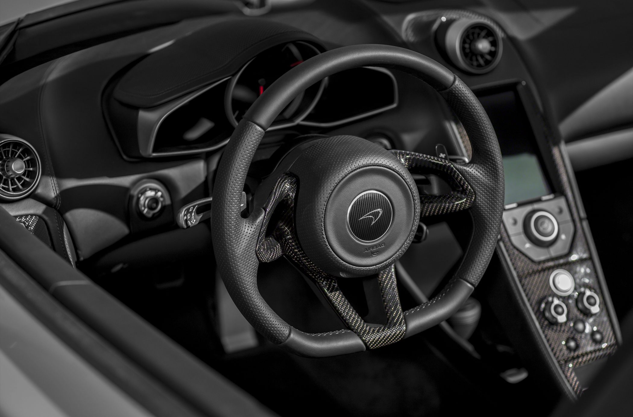 Sporty steering wheel with carbon fiber and control panel