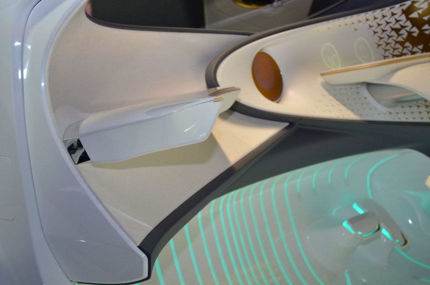 Interior door panel with ambient lighting and futuristic design elements