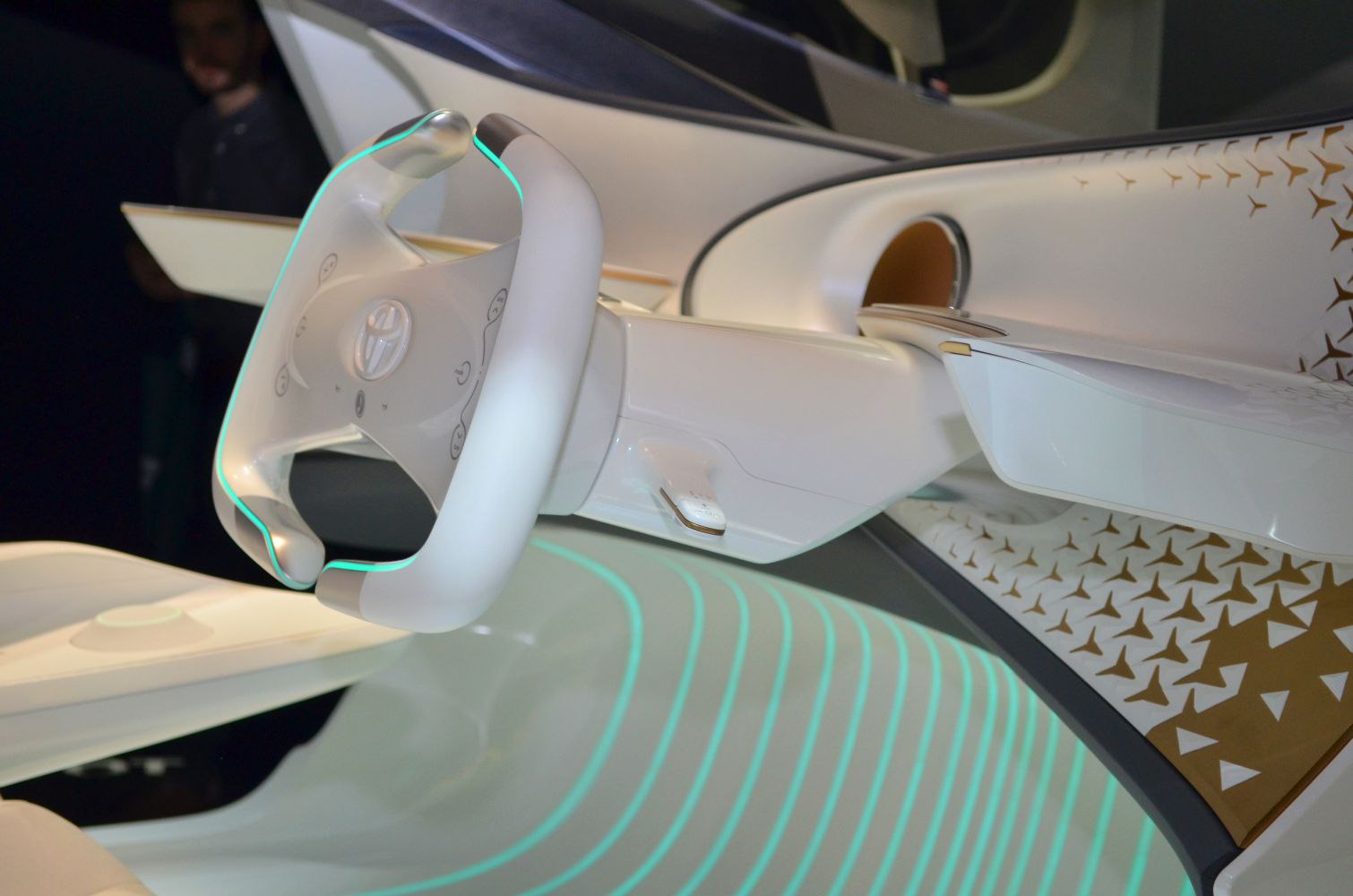 Futuristic steering wheel with integrated controls and illuminated dashboard