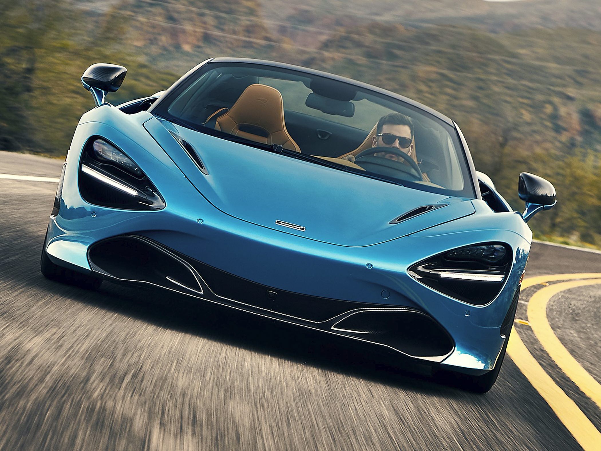 Convertible supercar with sleek aerodynamic front and distinct headlight design