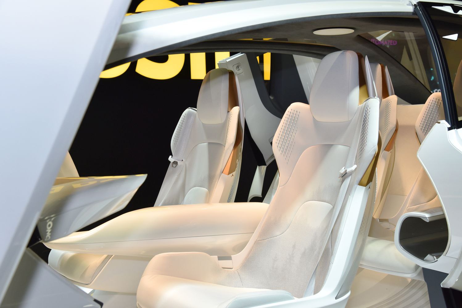 Futuristic white seats with minimalist design and innovative cabin layout