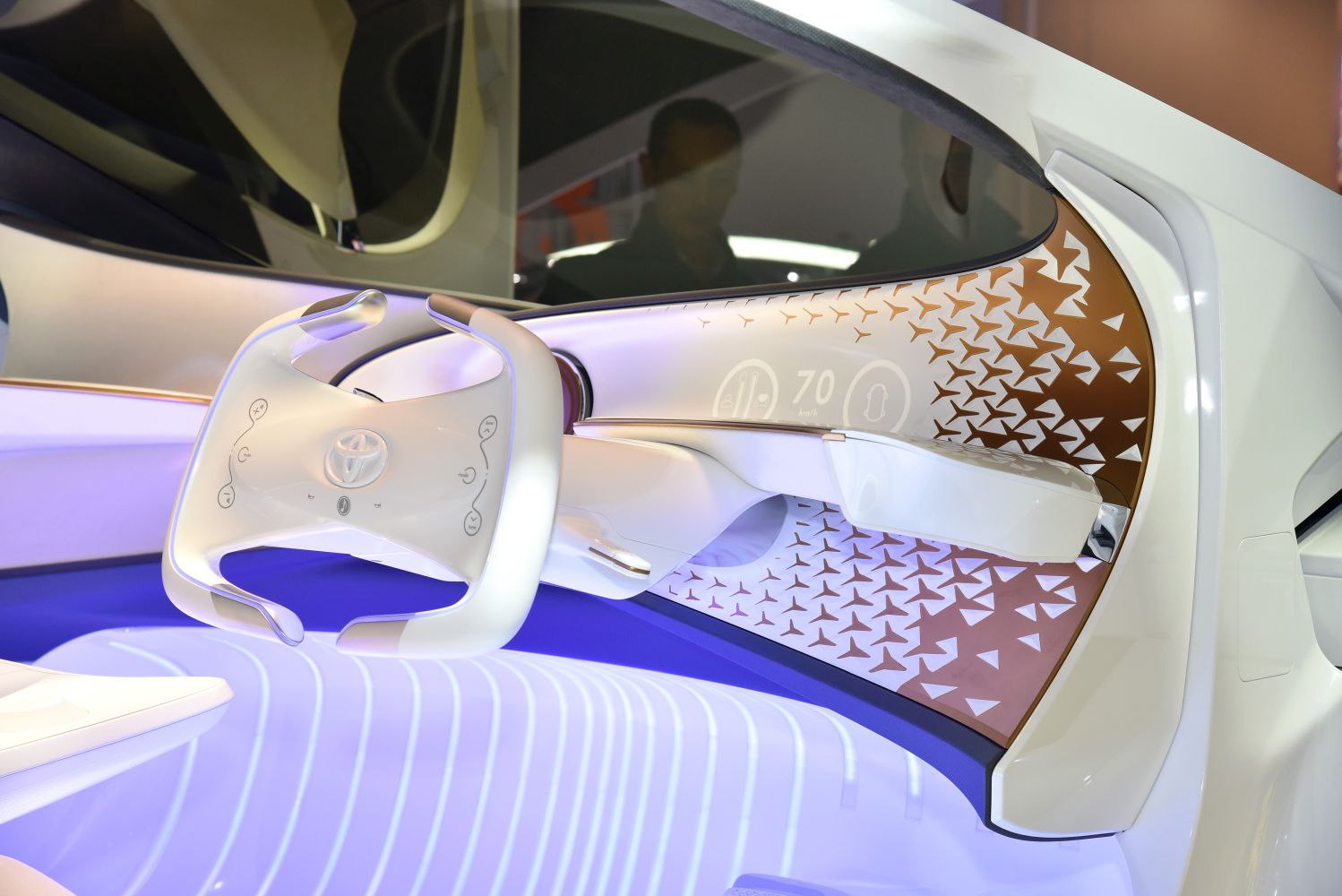 Futuristic steering wheel with digital dashboard and illuminated floor