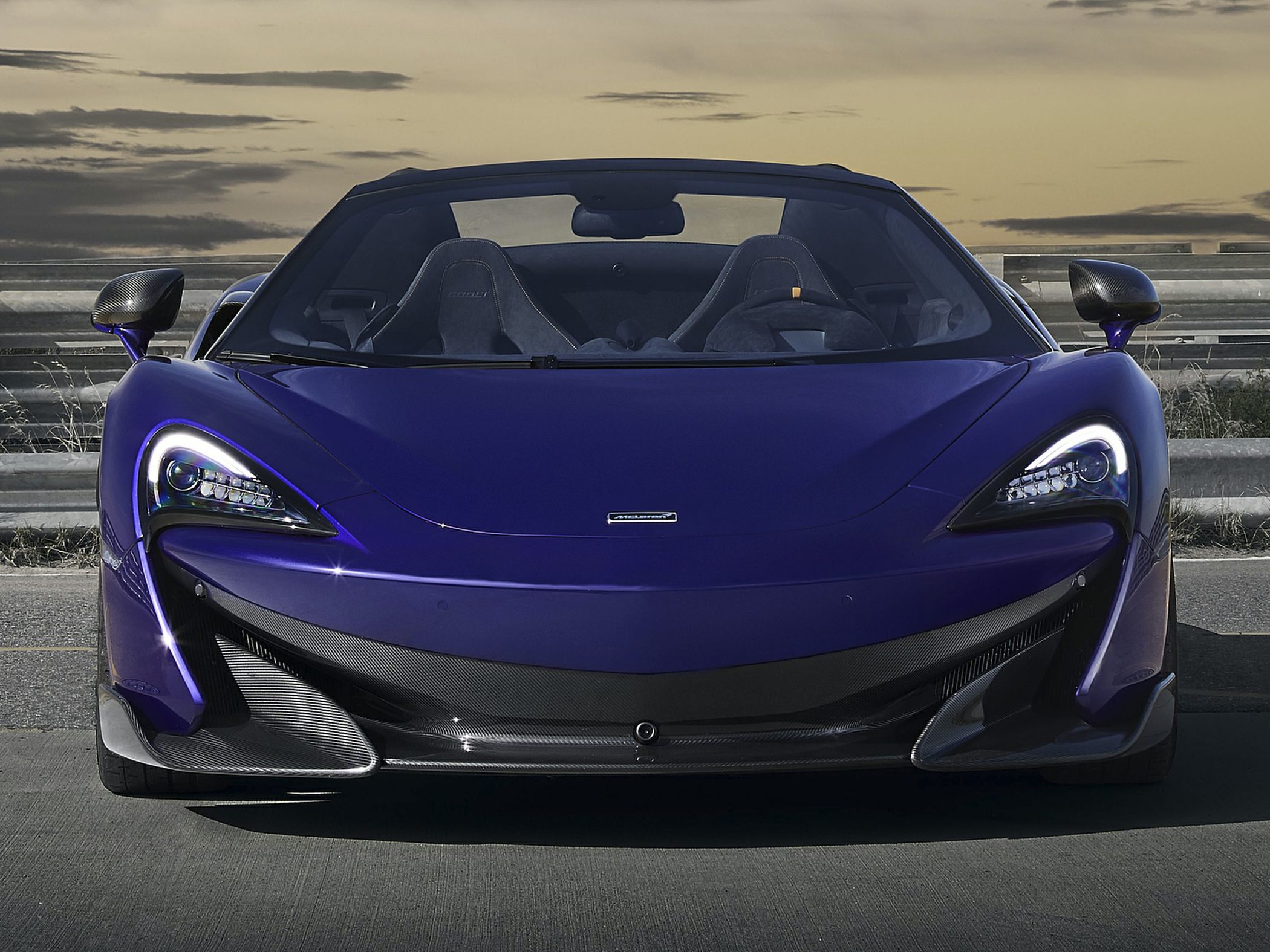 Front view with LED headlights and carbon fiber aerodynamic features