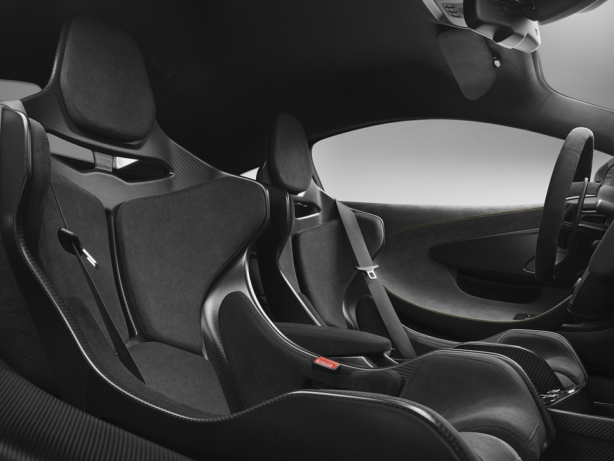 Carbon fiber racing seats with Alcantara upholstery in sports car interior
