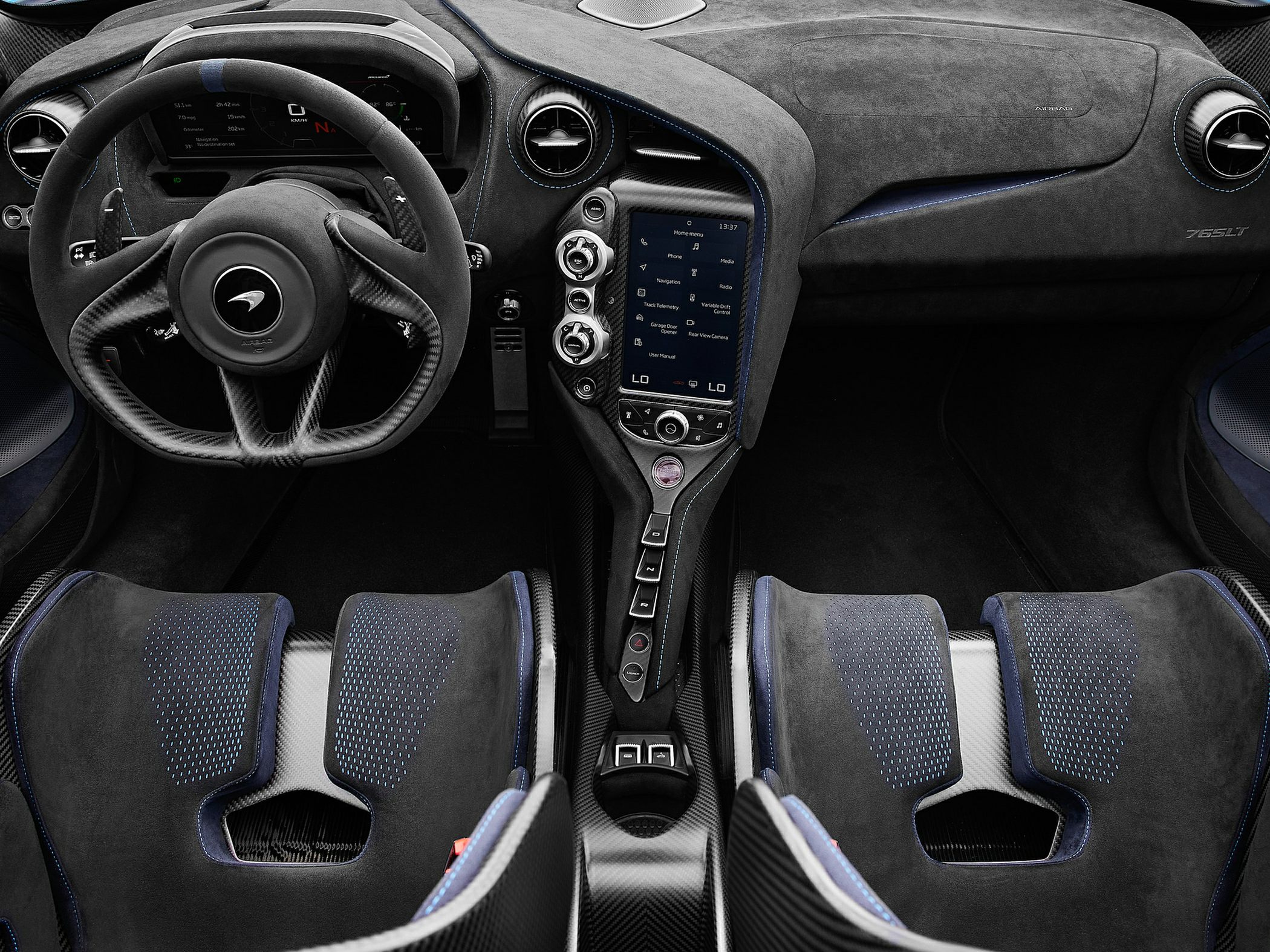 Sporty interior with digital instrument cluster, carbon fiber steering wheel, and high-performance seats