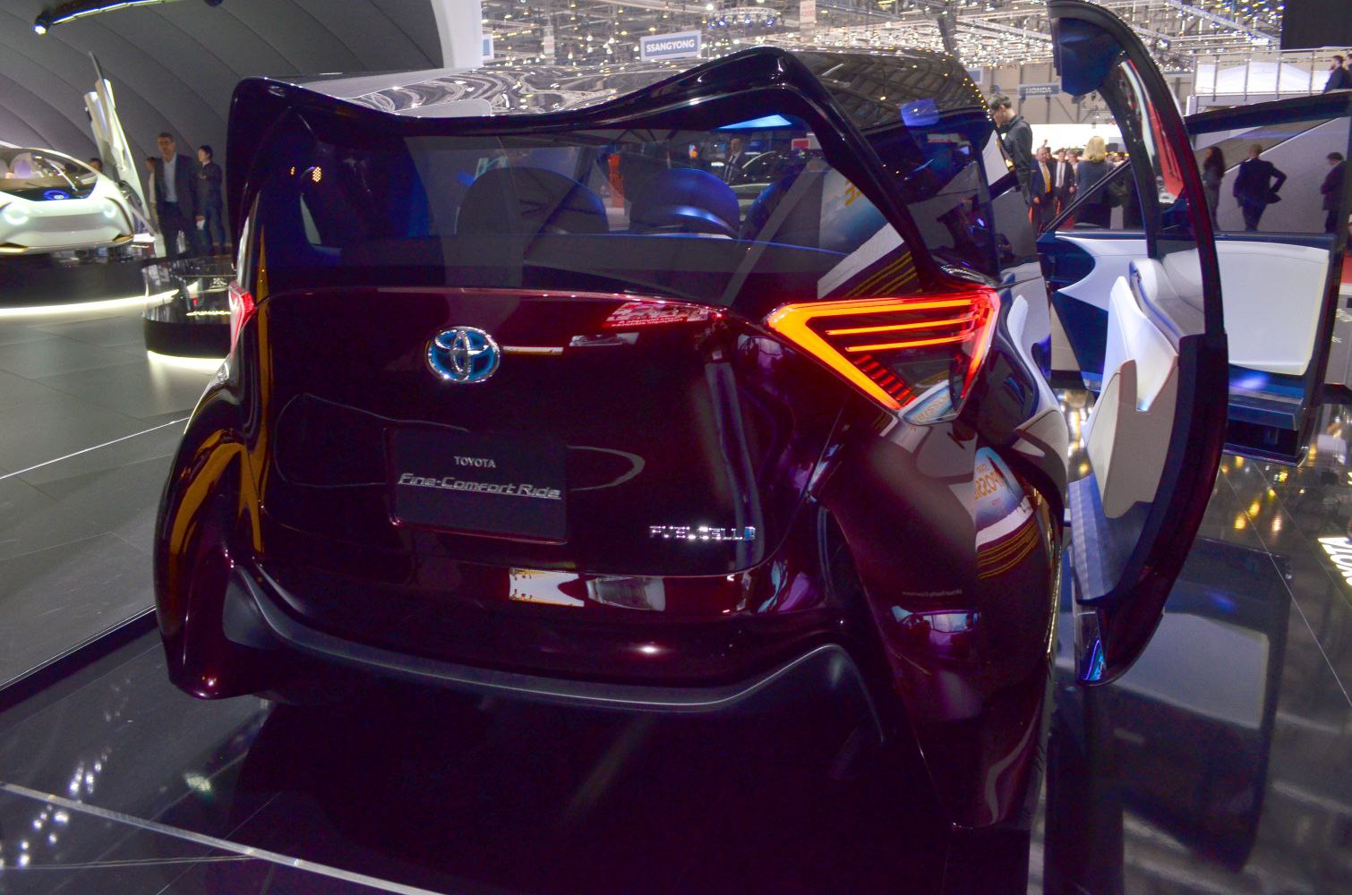 Rear view with geometric illuminated tail lights and open rear door