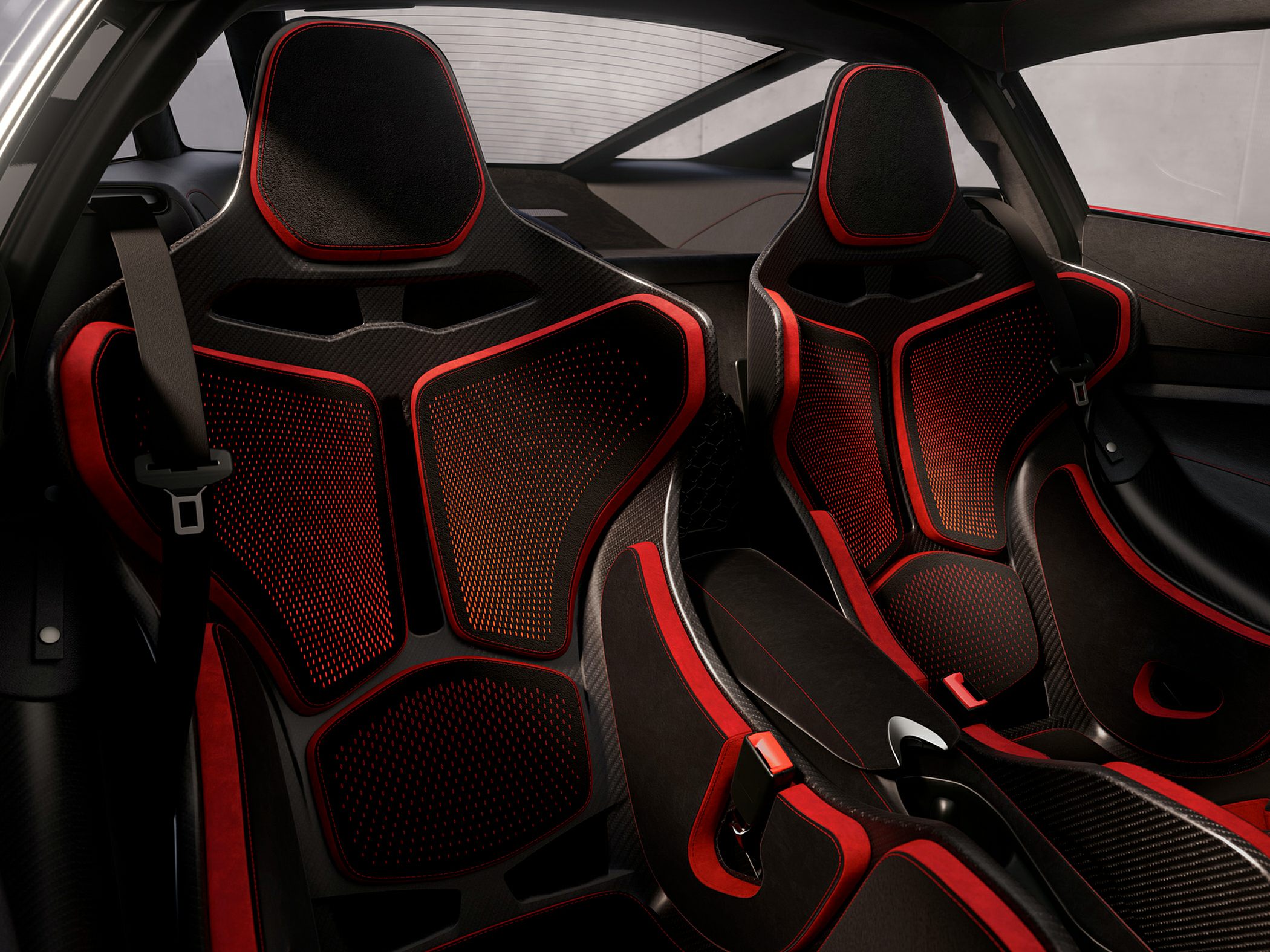 Carbon fiber racing seats with red accent details