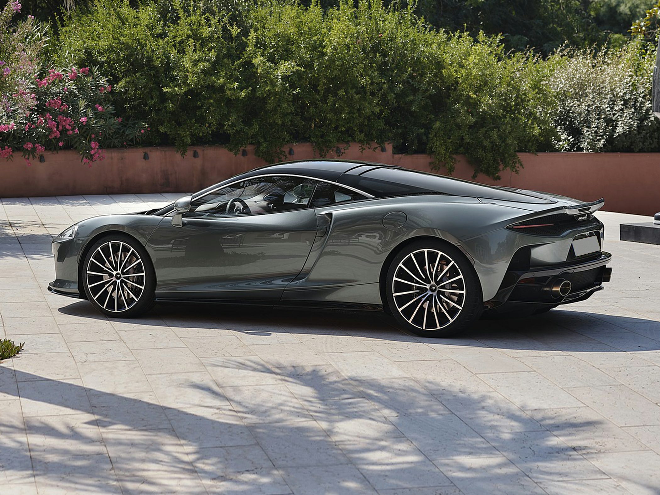 Sleek aerodynamic side profile with distinctive sporty wheels.