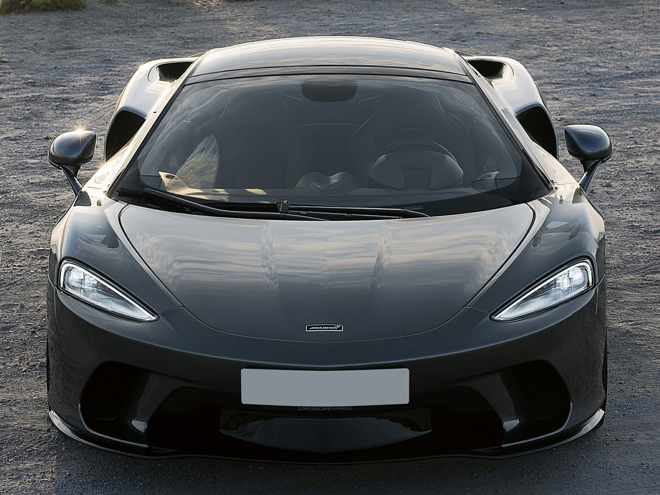 Front view of aerodynamic sports car with sleek LED headlights