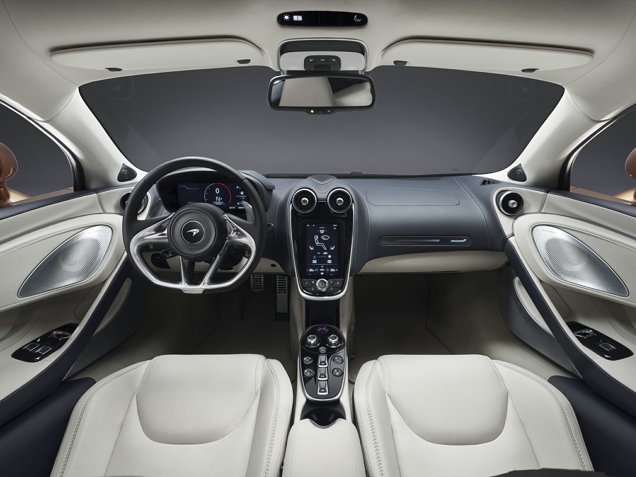 Luxurious steering wheel, digital dashboard, and center console.