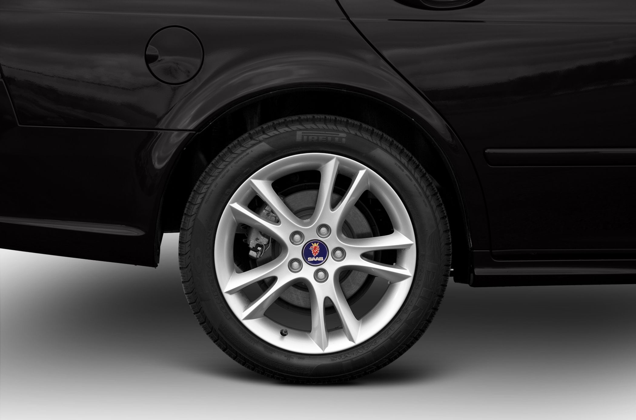 Rear alloy wheel and fuel cap in detail