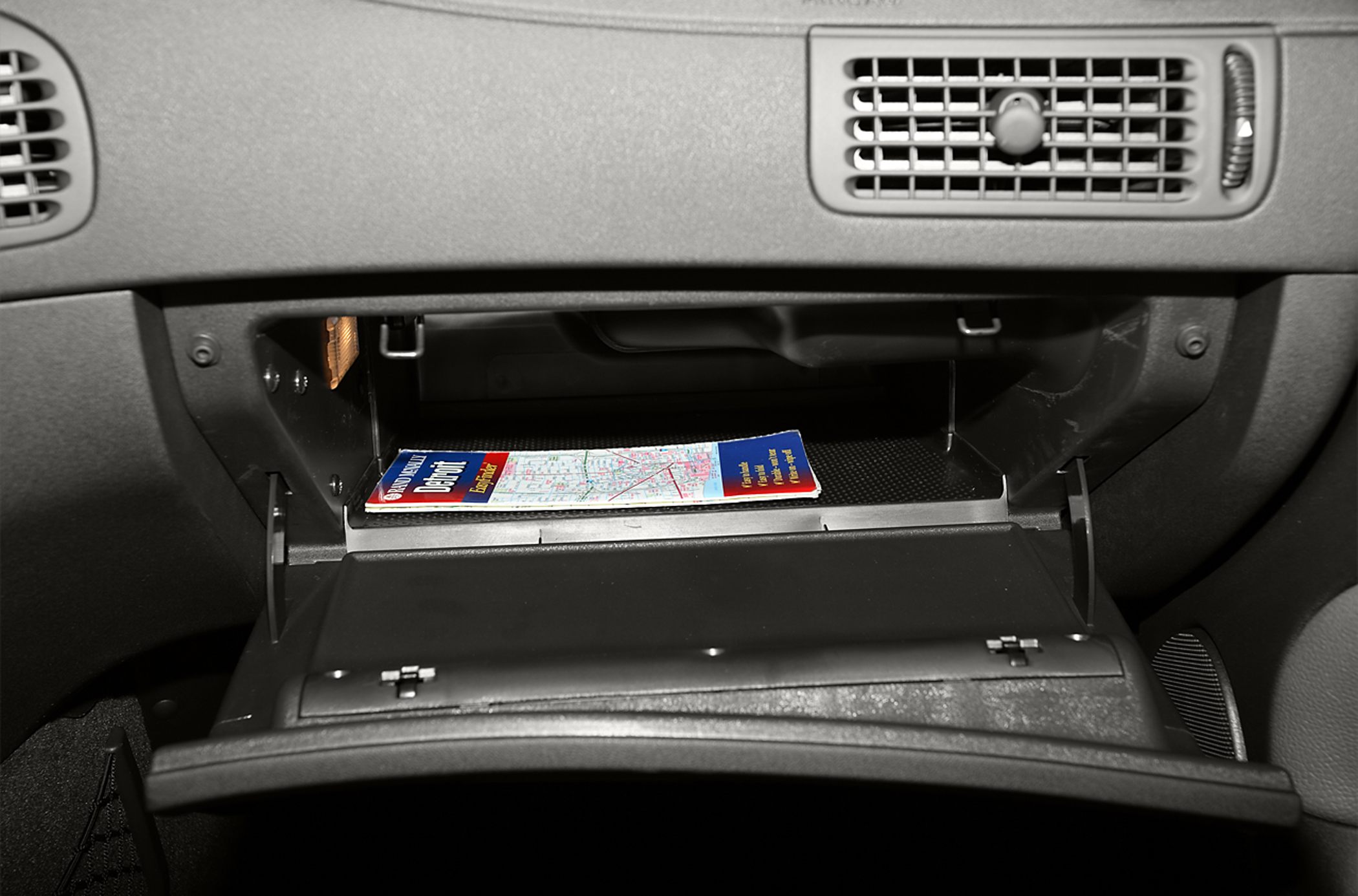 Glove compartment with map and dashboard air vents
