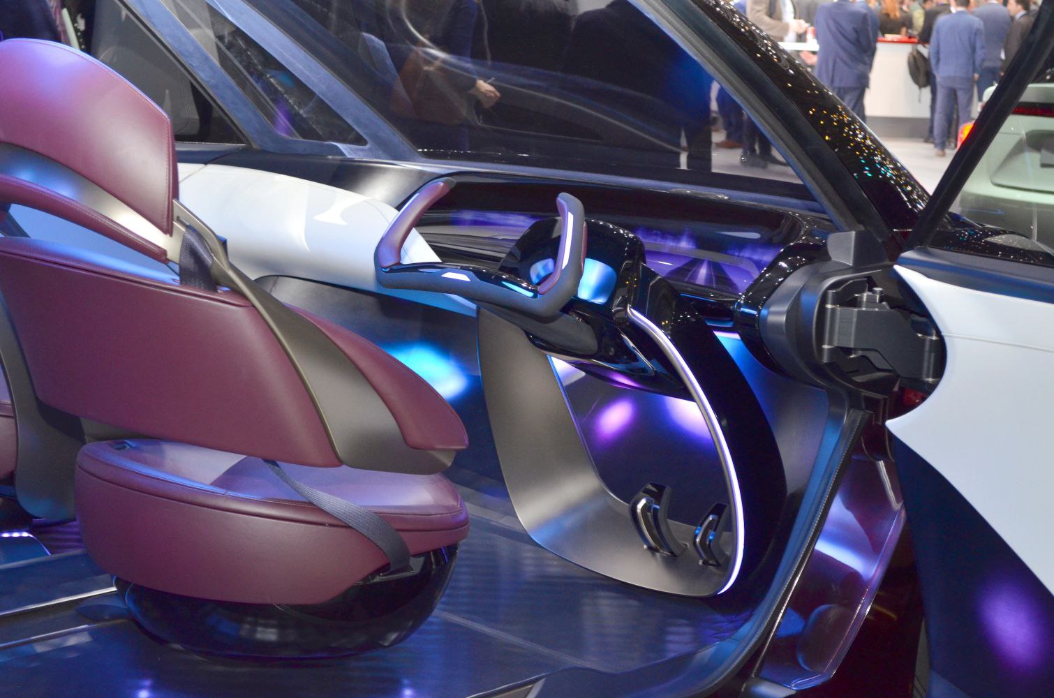Futuristic floating steering wheel with ambient lighting in a concept car interior