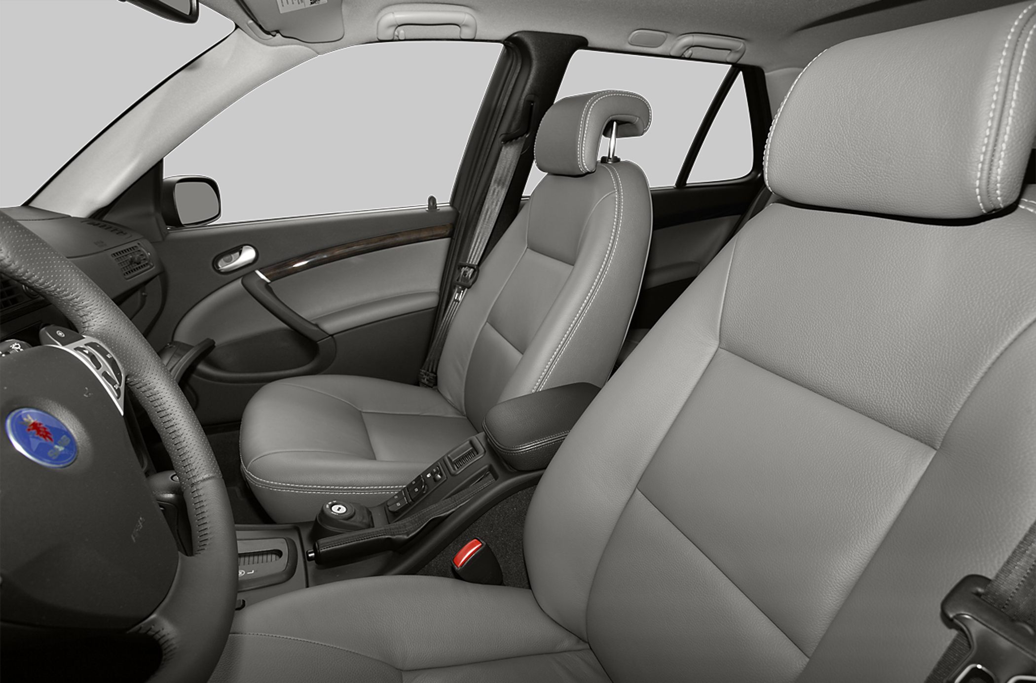 Front passenger leather seats with stitching and car interior details