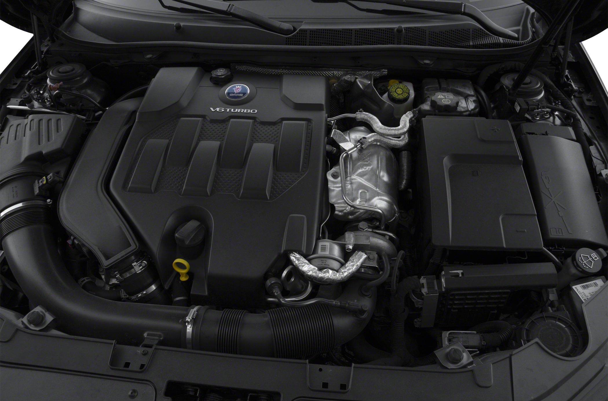 Close-up view of a V6 turbo engine with visible turbo components and engine cover