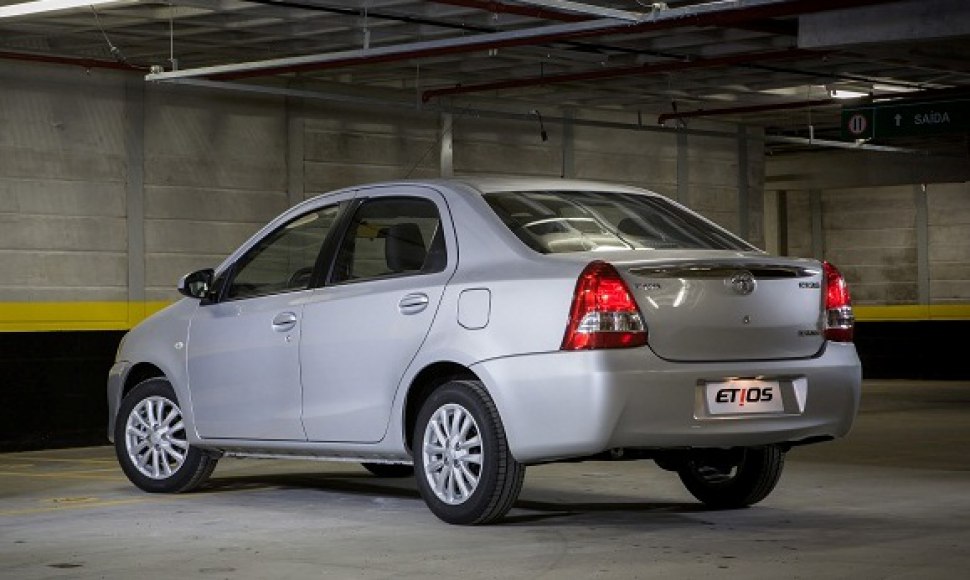 Rear three-quarter view of a silver sedan with distinctive tail lights.