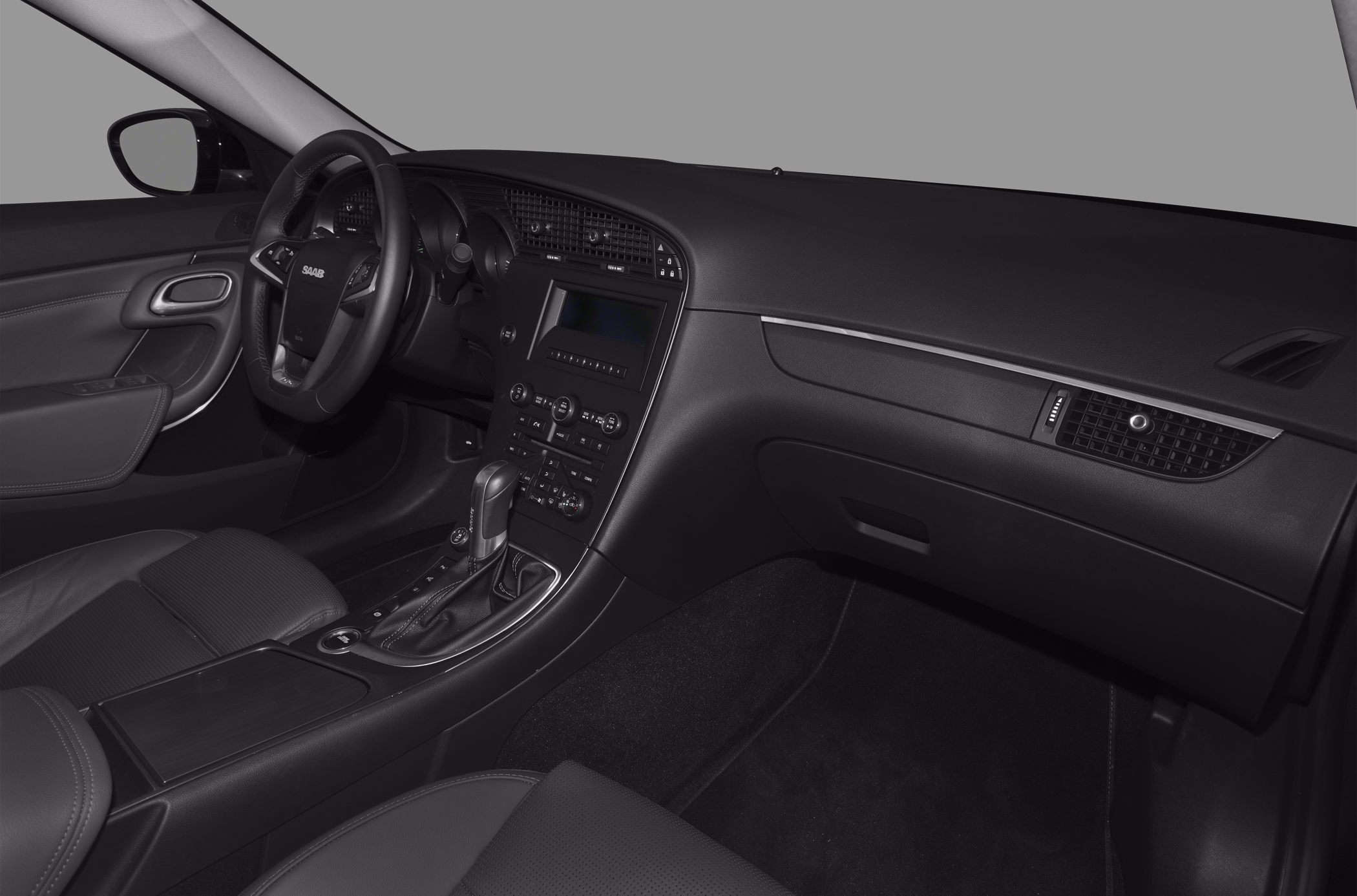 Dashboard, steering wheel, and center console of a car interior