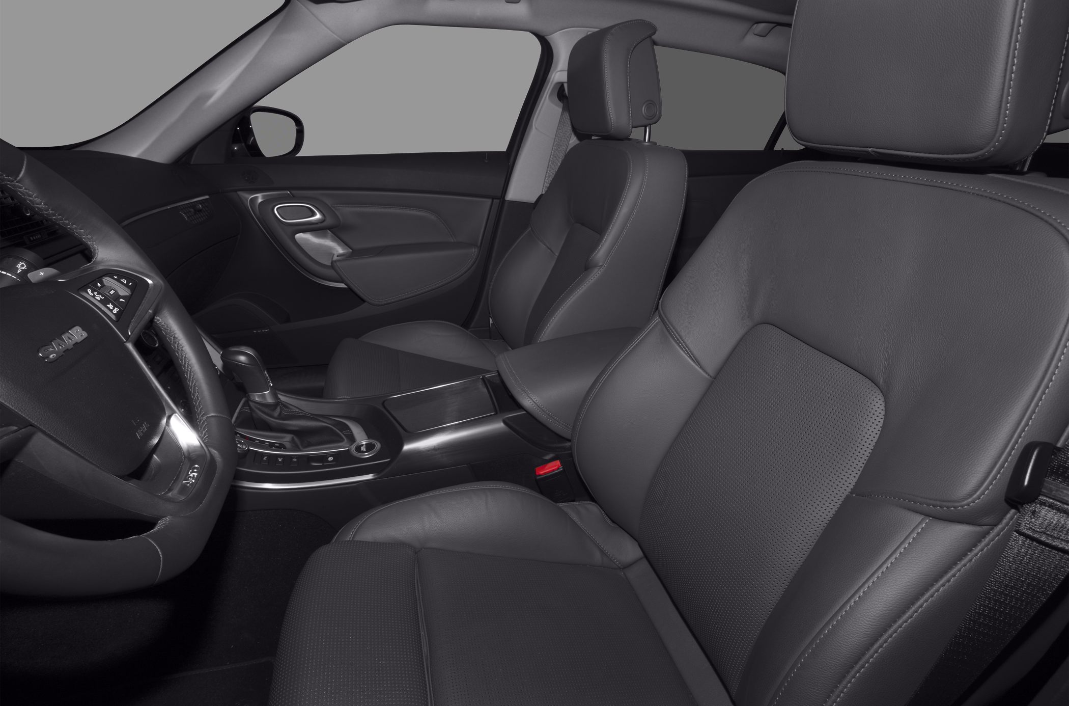 Front leather seats, steering wheel, and center console with gear shifter