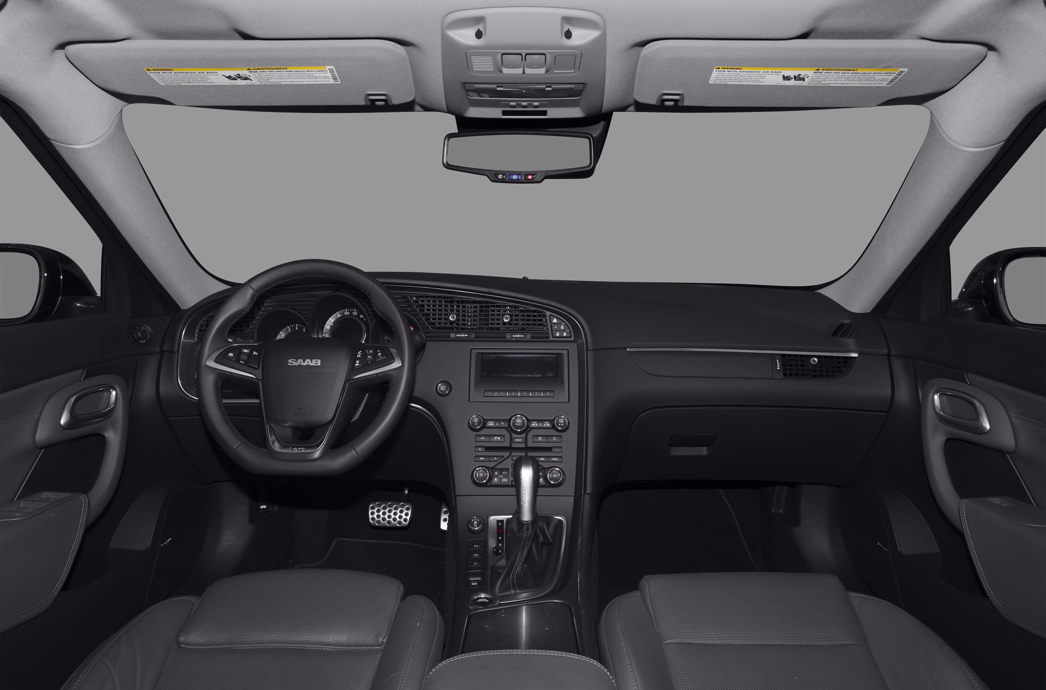 Dashboard and steering wheel interior view with central console controls.