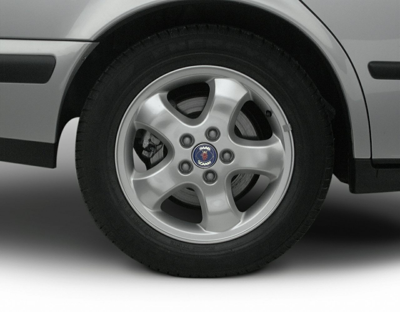 Close-up of Saab 9-5 alloy wheel and tire from 1997-2001 production.