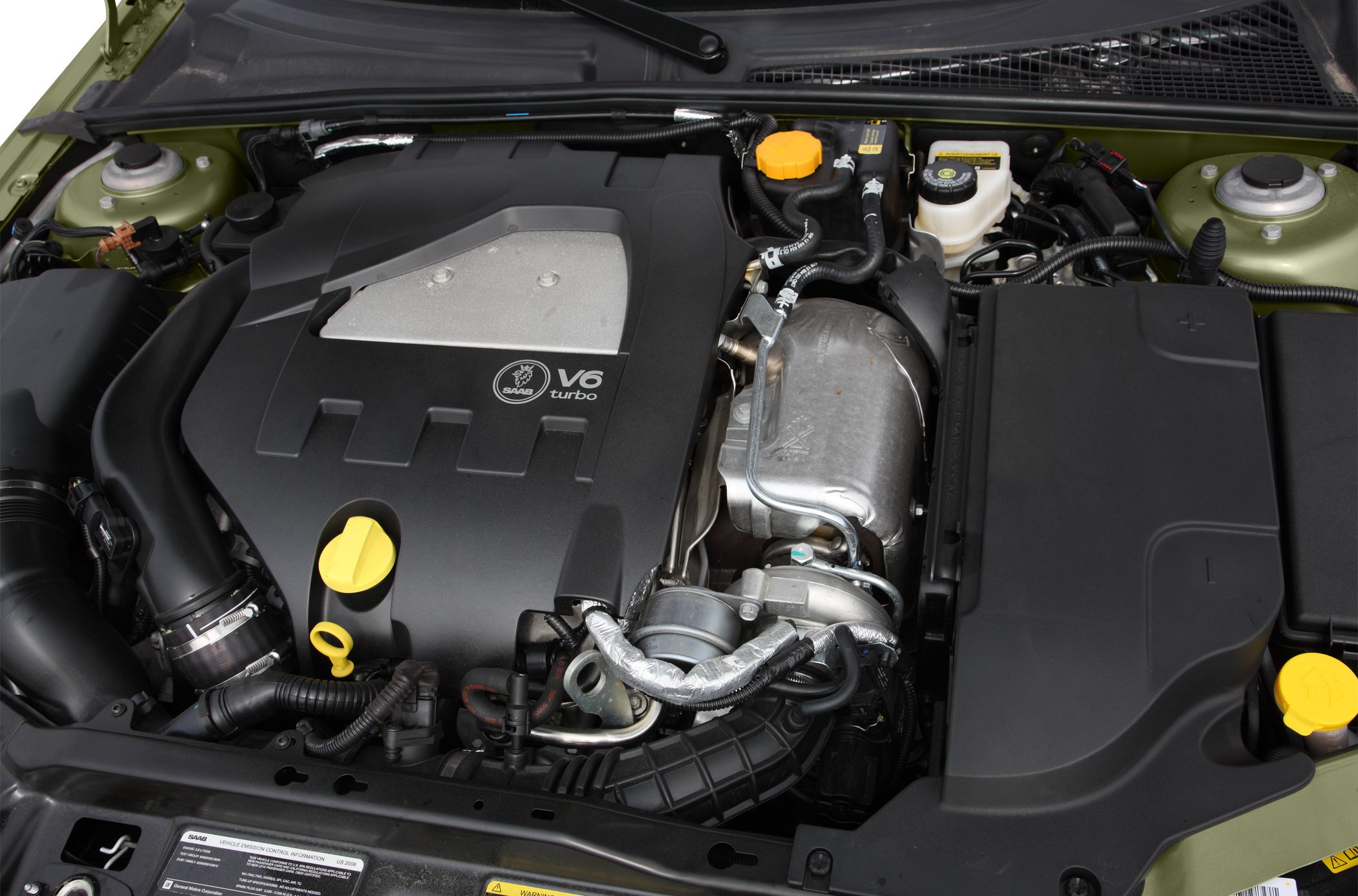 Turbocharged V6 engine with visible mechanical components and fluid reservoirs
