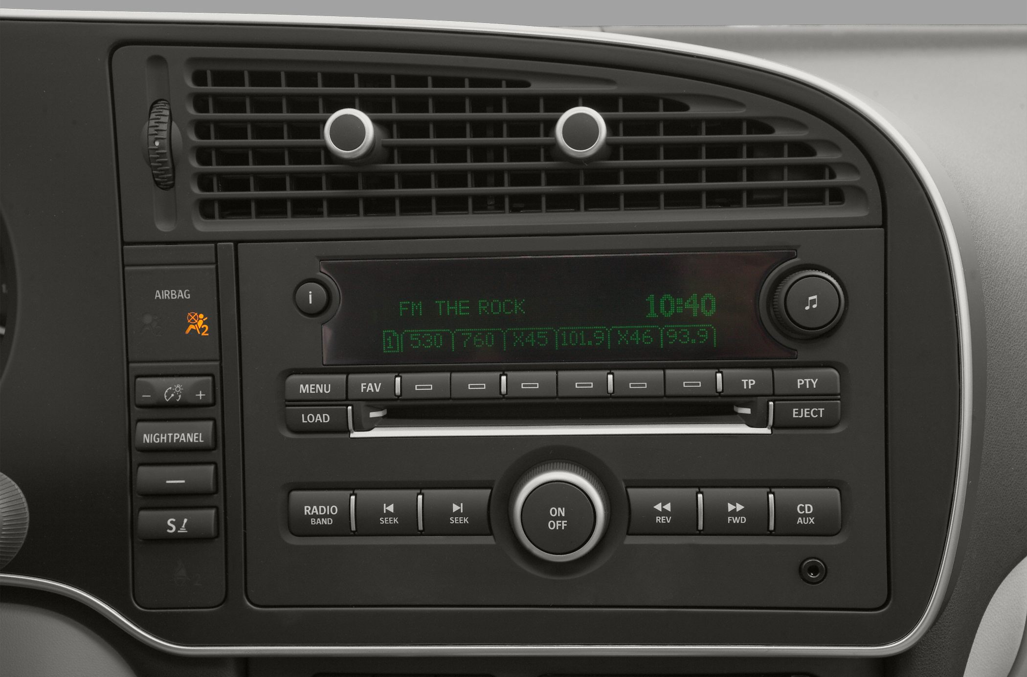 Car radio and climate control panel with air vents in dashboard.