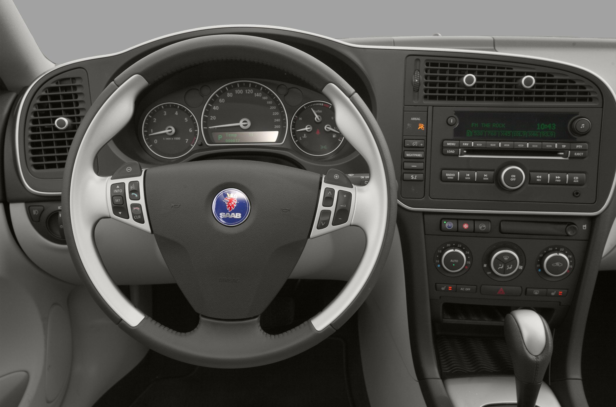 Steering wheel with instrument cluster and center console controls