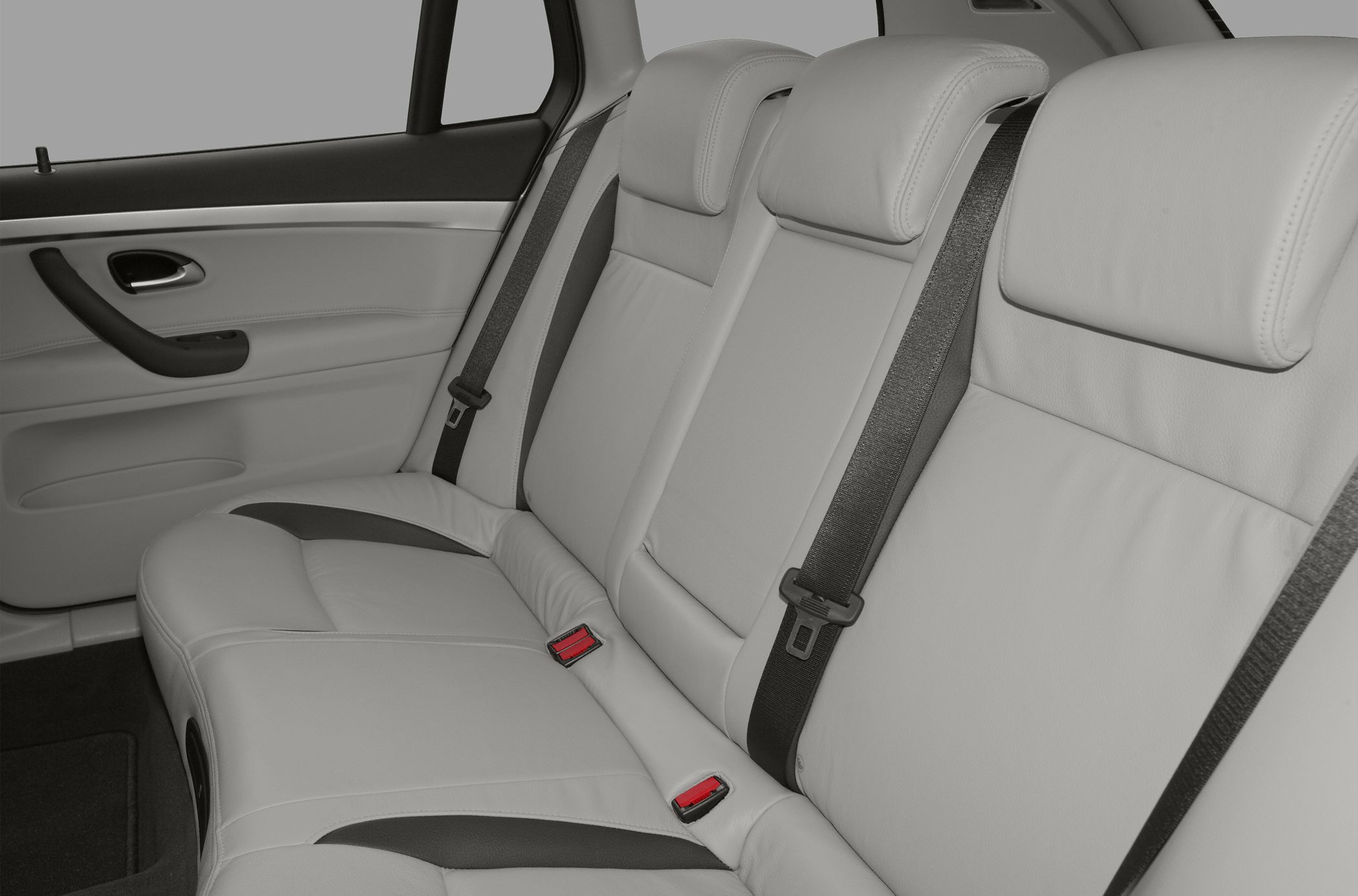 Rear leather seats with seat belts and door panel.