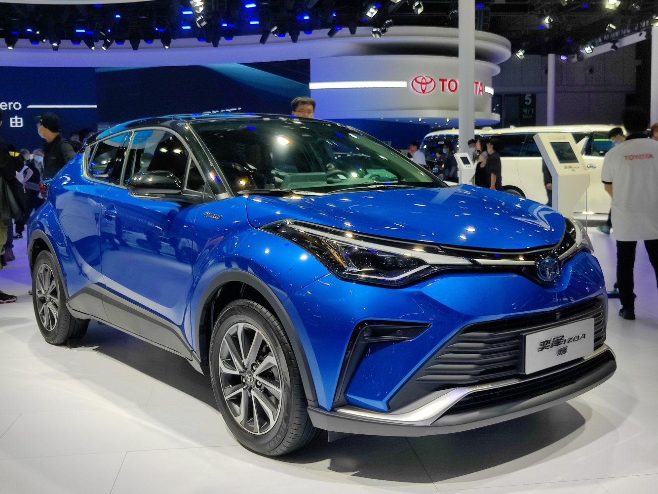 Blue crossover SUV with sleek front grille and modern headlamps